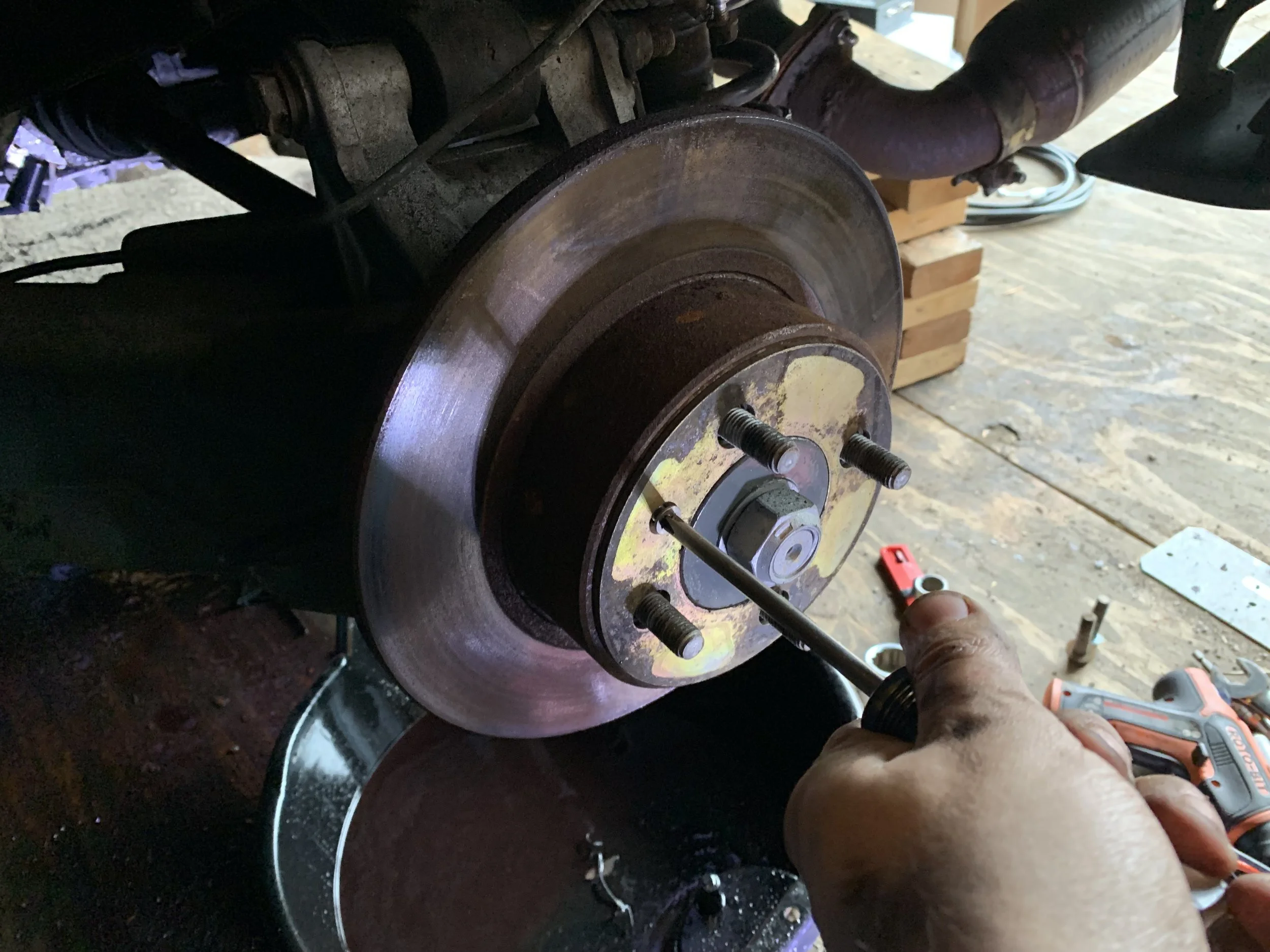 Removing the spacer from the rotor. You’ll need this for the new system.
