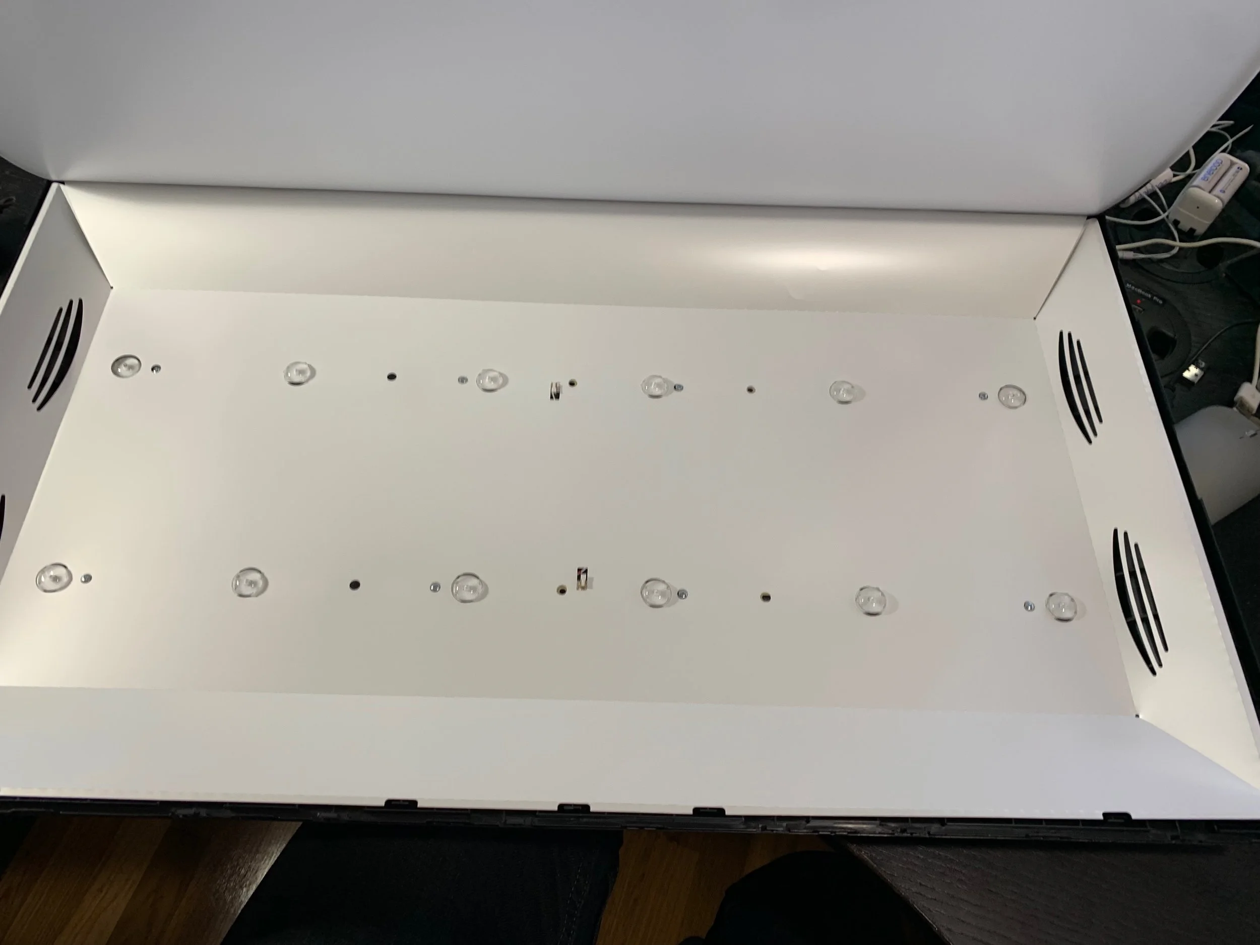 The LED backlight behind of the newer-model TV. It’s just a big box made of card stock with LEDs inside. Diffusers sits between the panel and the box.