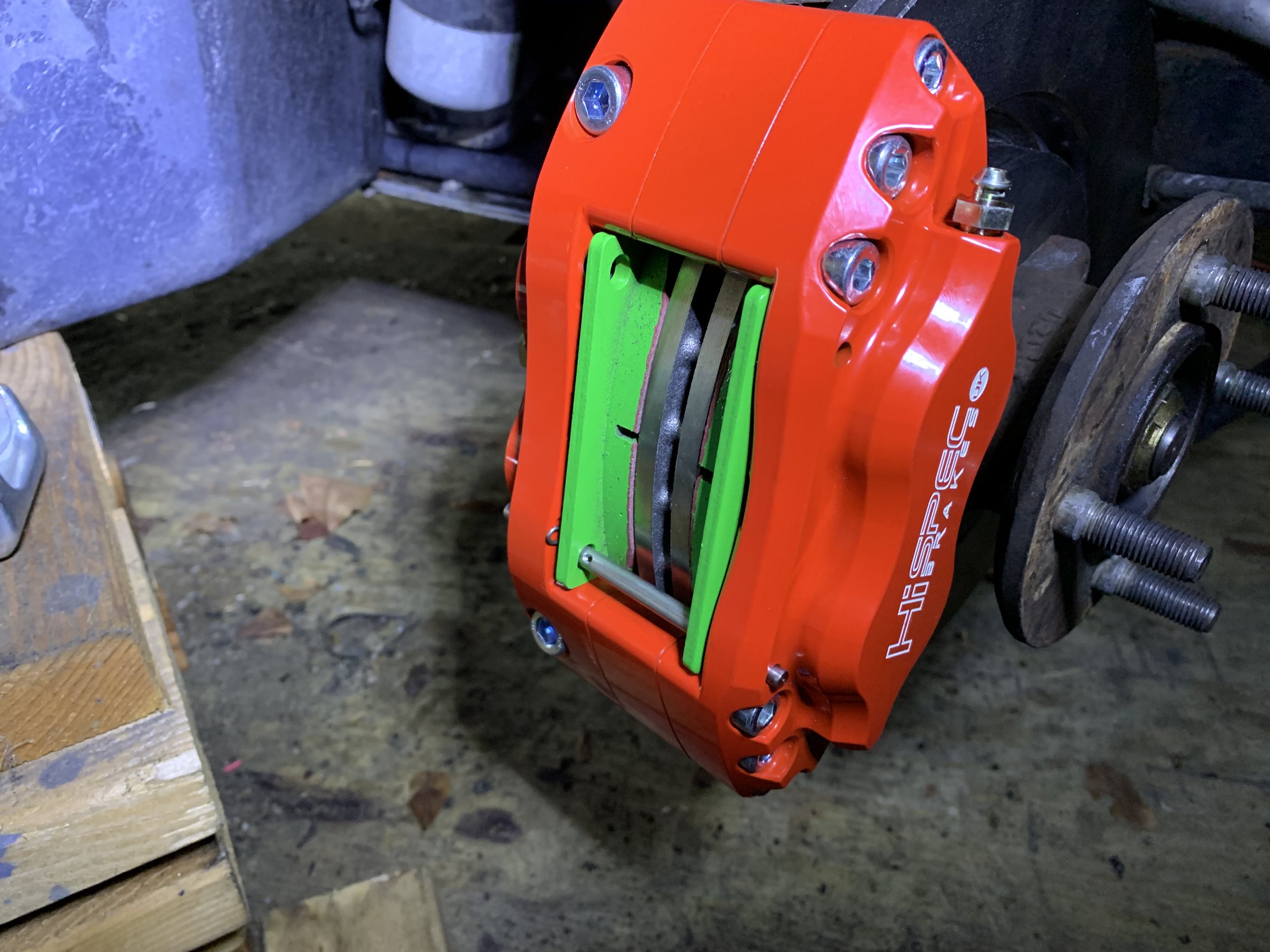 The first pin installed, with its cotter pin inserted on the outside of the pad.