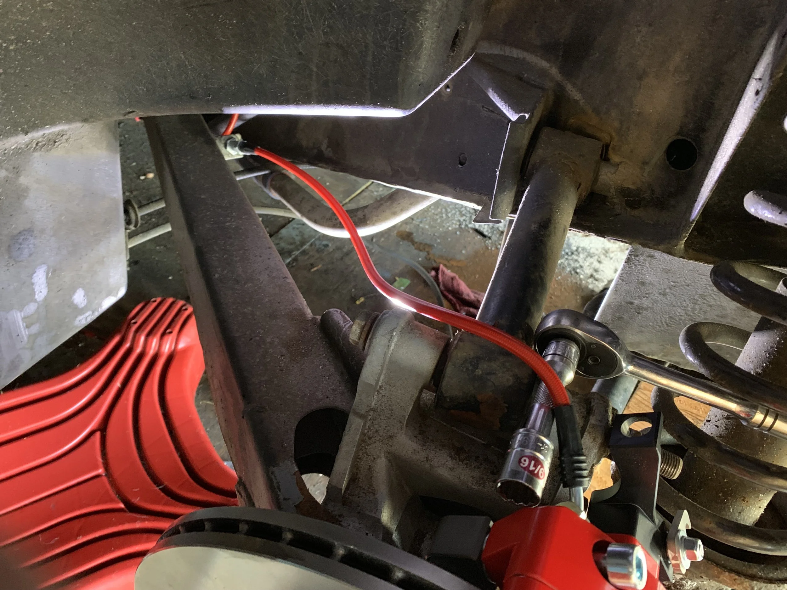 The correctly installed rear brake lines.