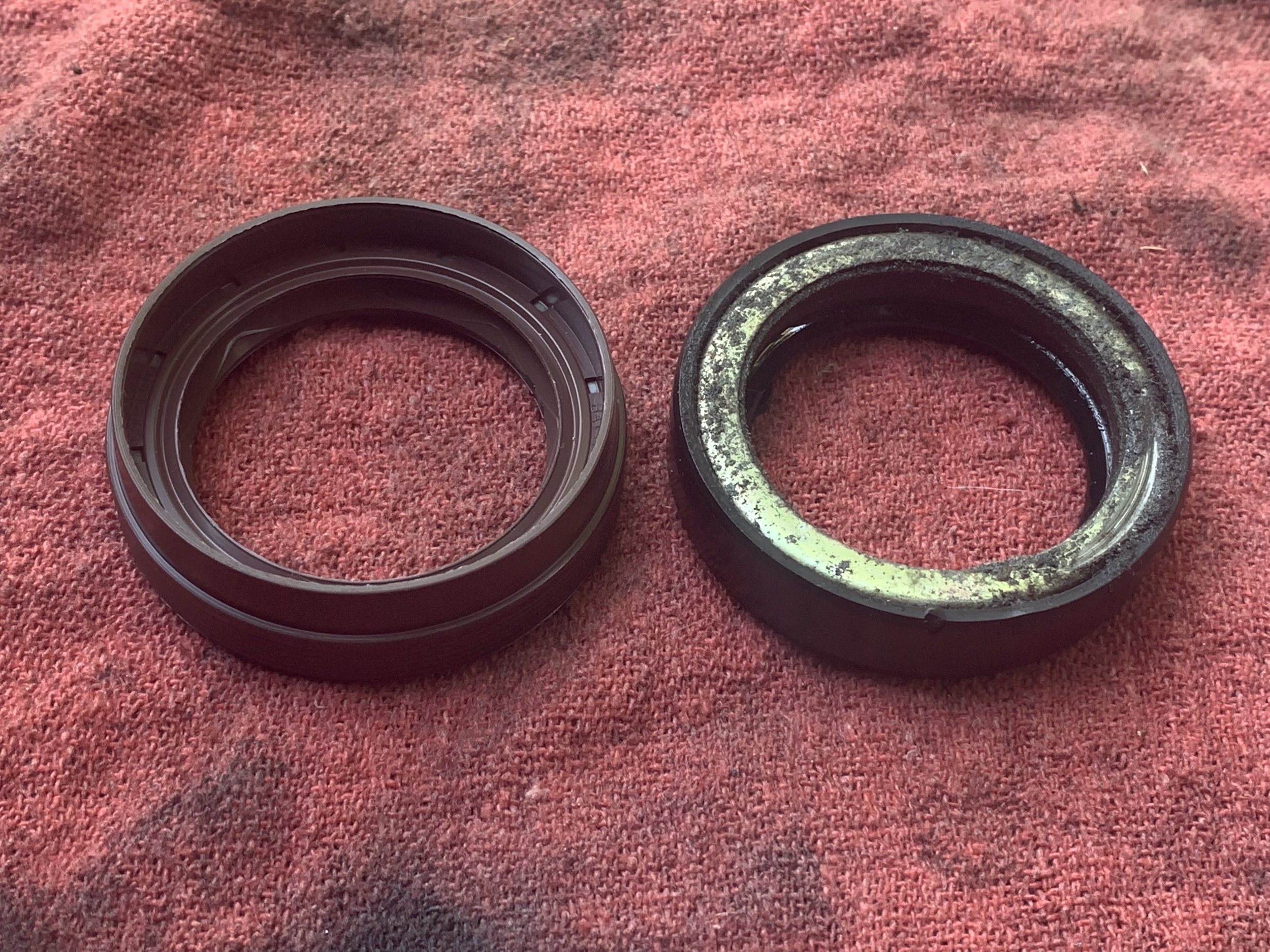 The new triple lip seal(left) and the original seal (right).