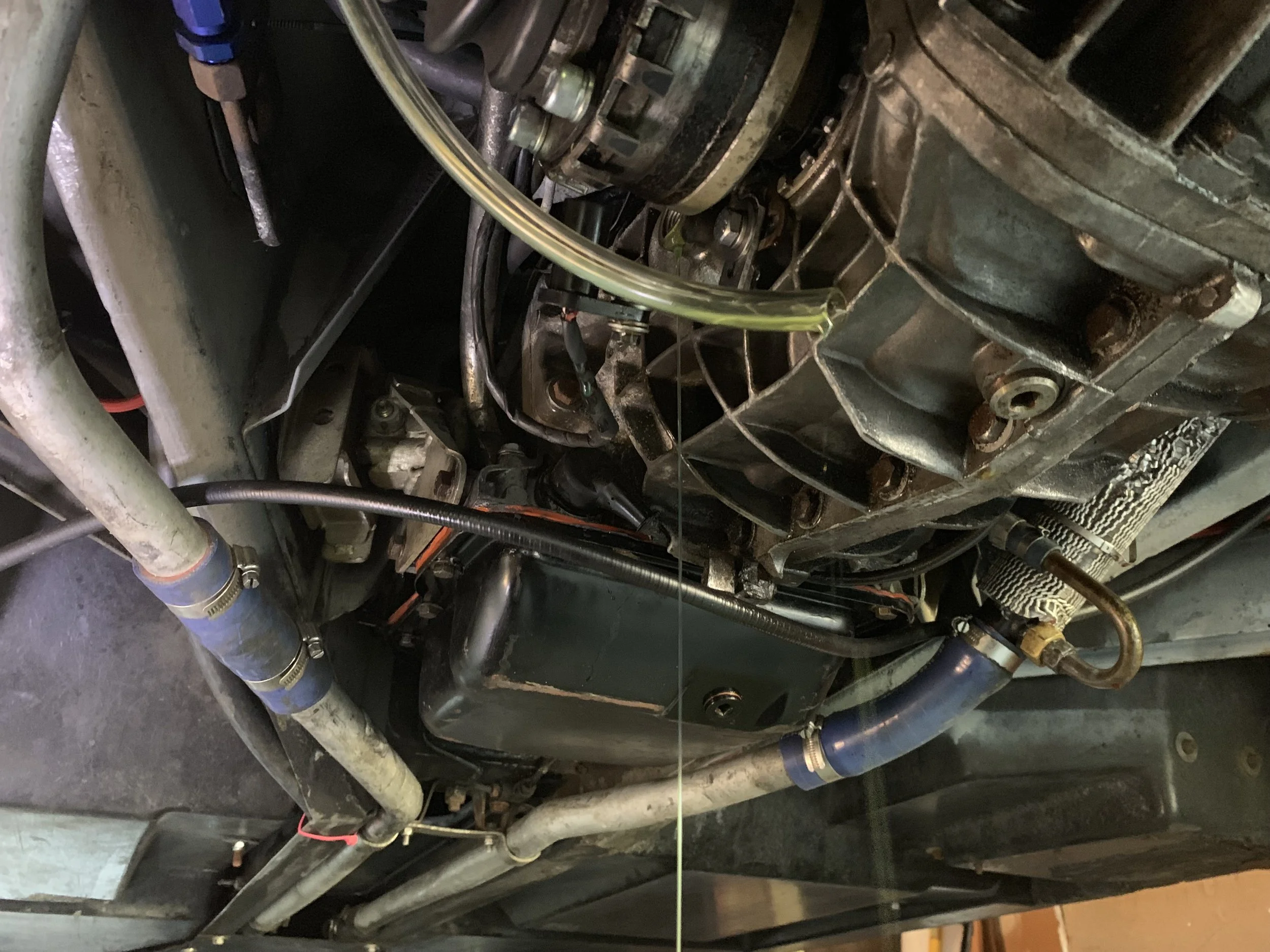 After filling, excess oil drains out of the hole. The fill level is at the bottom of the hole, so once it stops dripping, it’s full.