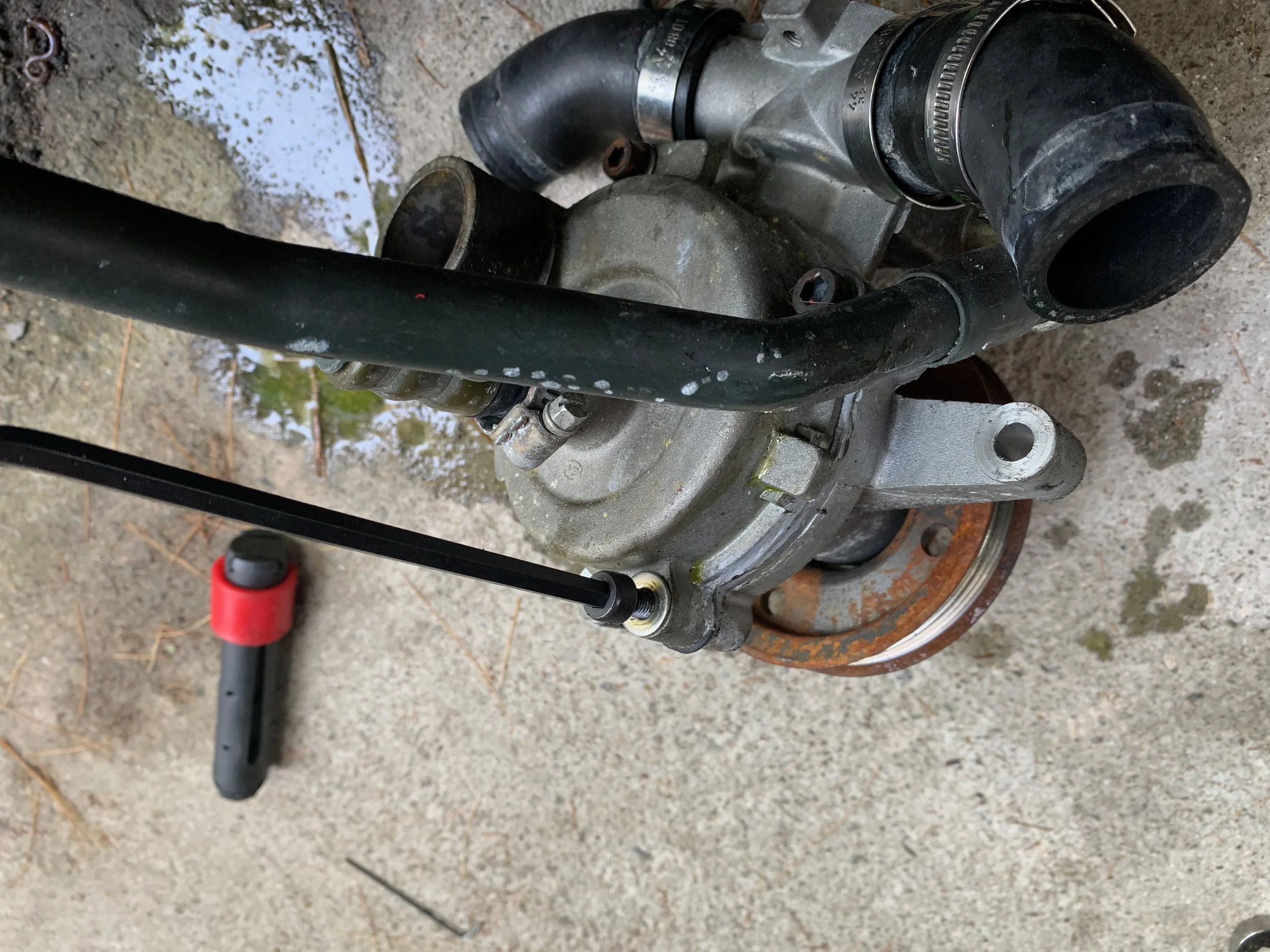 Removing the back of the pump with a hex wrench.
