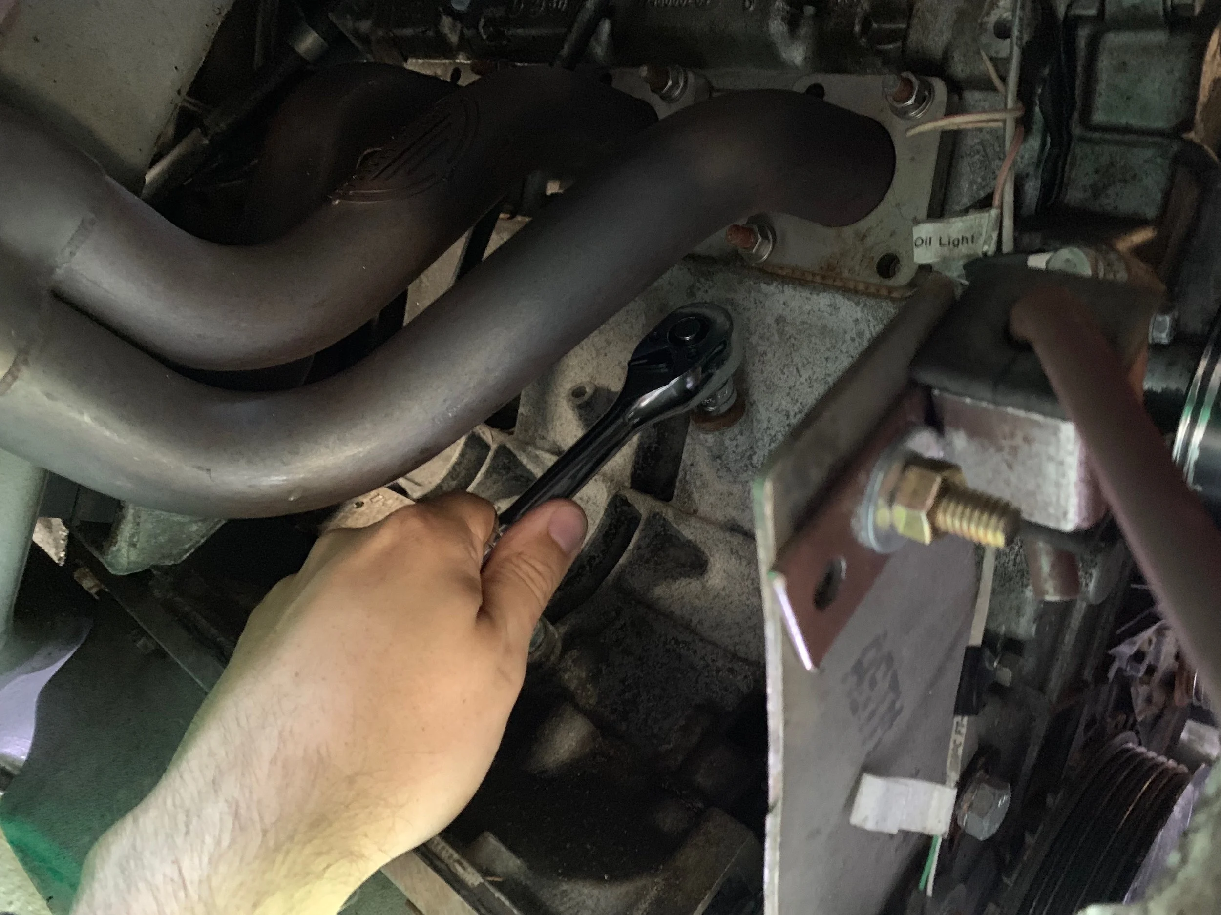 Removing the first drain plug.