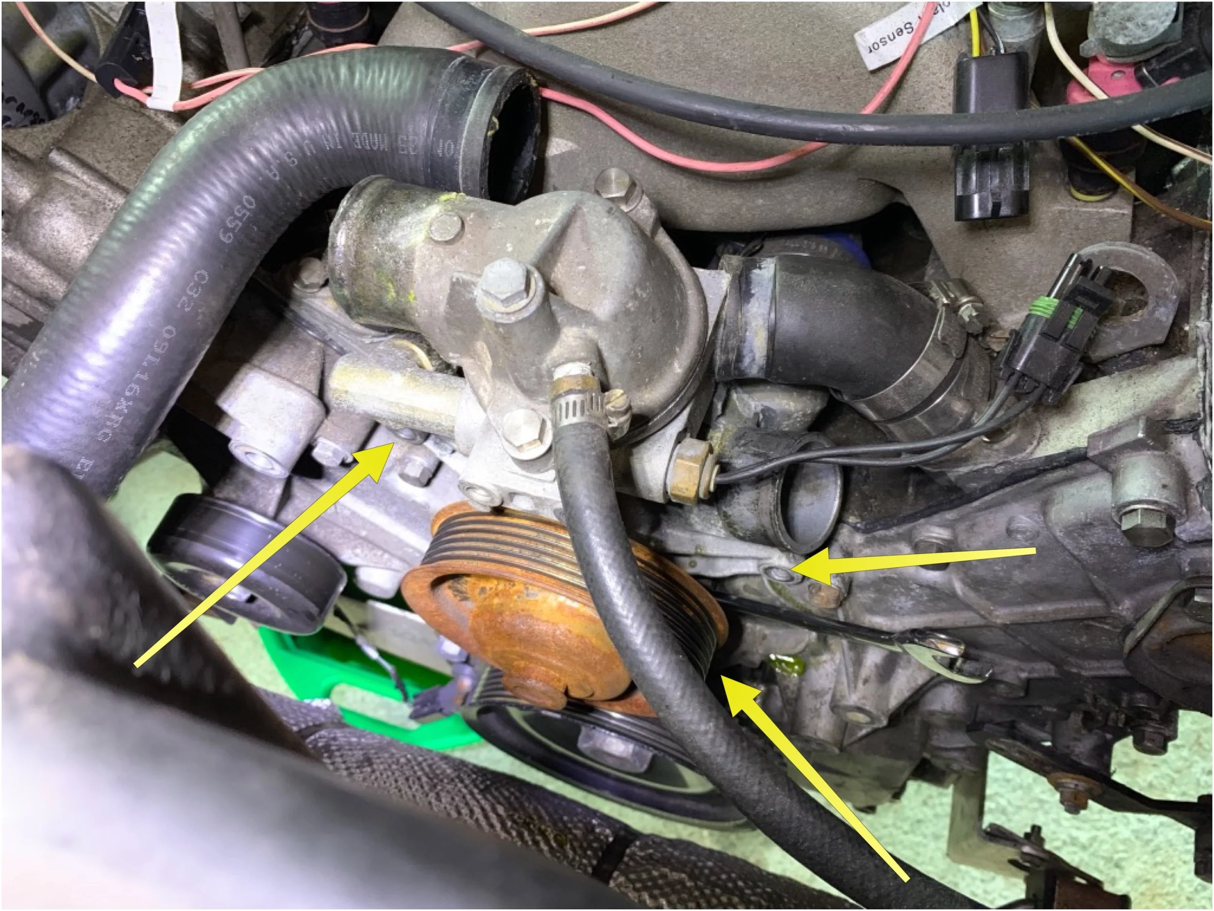 The location of the water pump bolts.