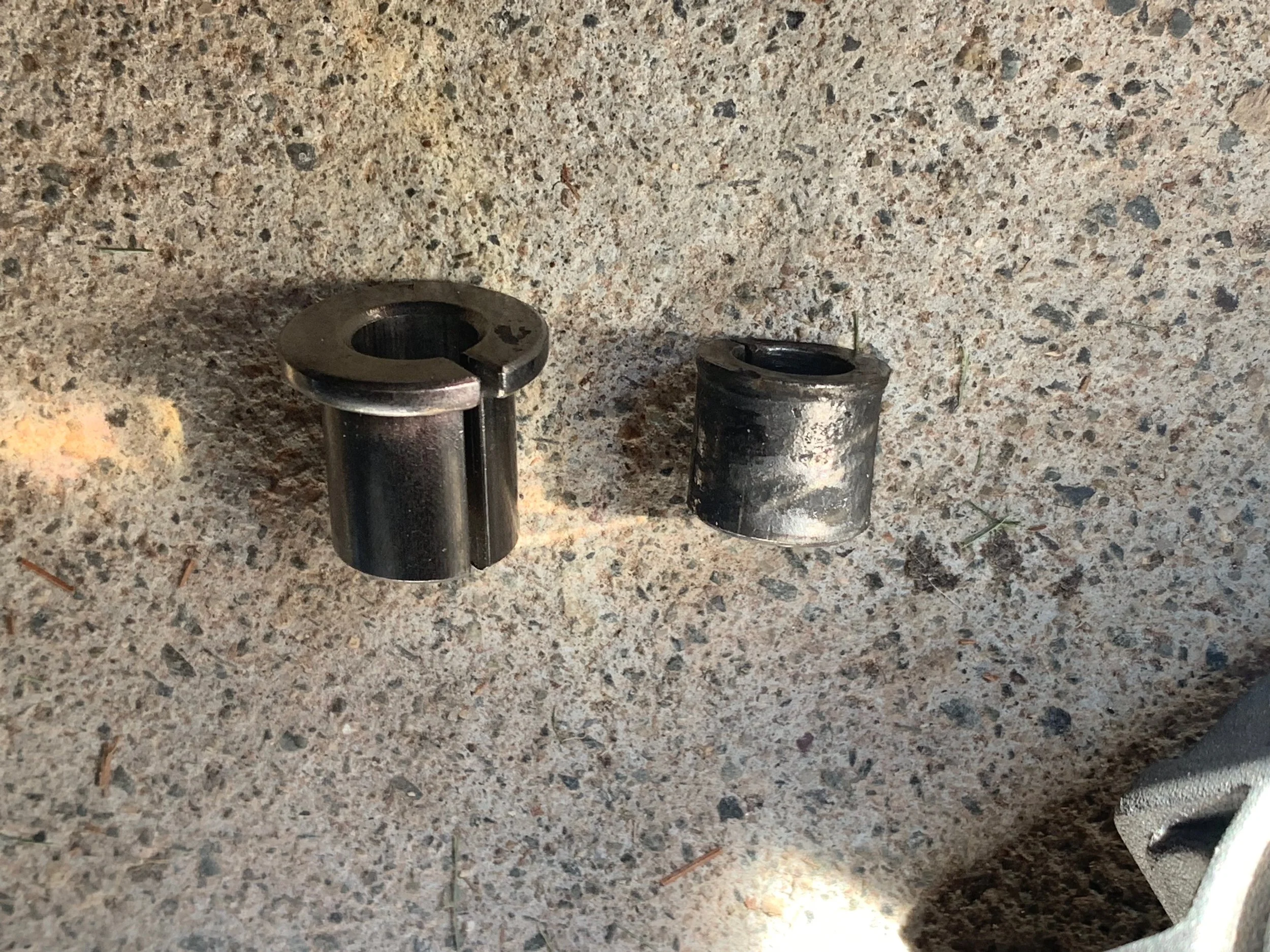 The spacer/reducer from the new alternator (left) and the one from the old alternator (right).
