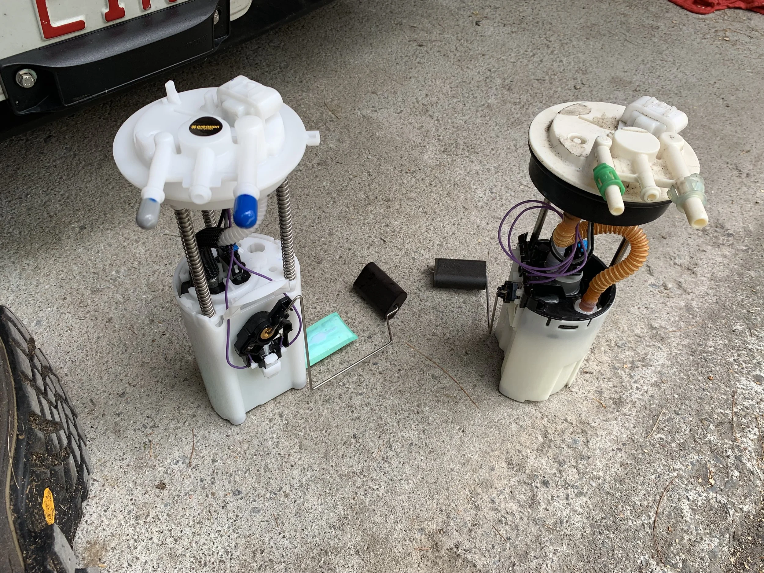 The Tahoe pump (left) and DeLorean pump (right). Note the position of the sender arm, and the difference in height. Otherwise they’re pretty much the same.