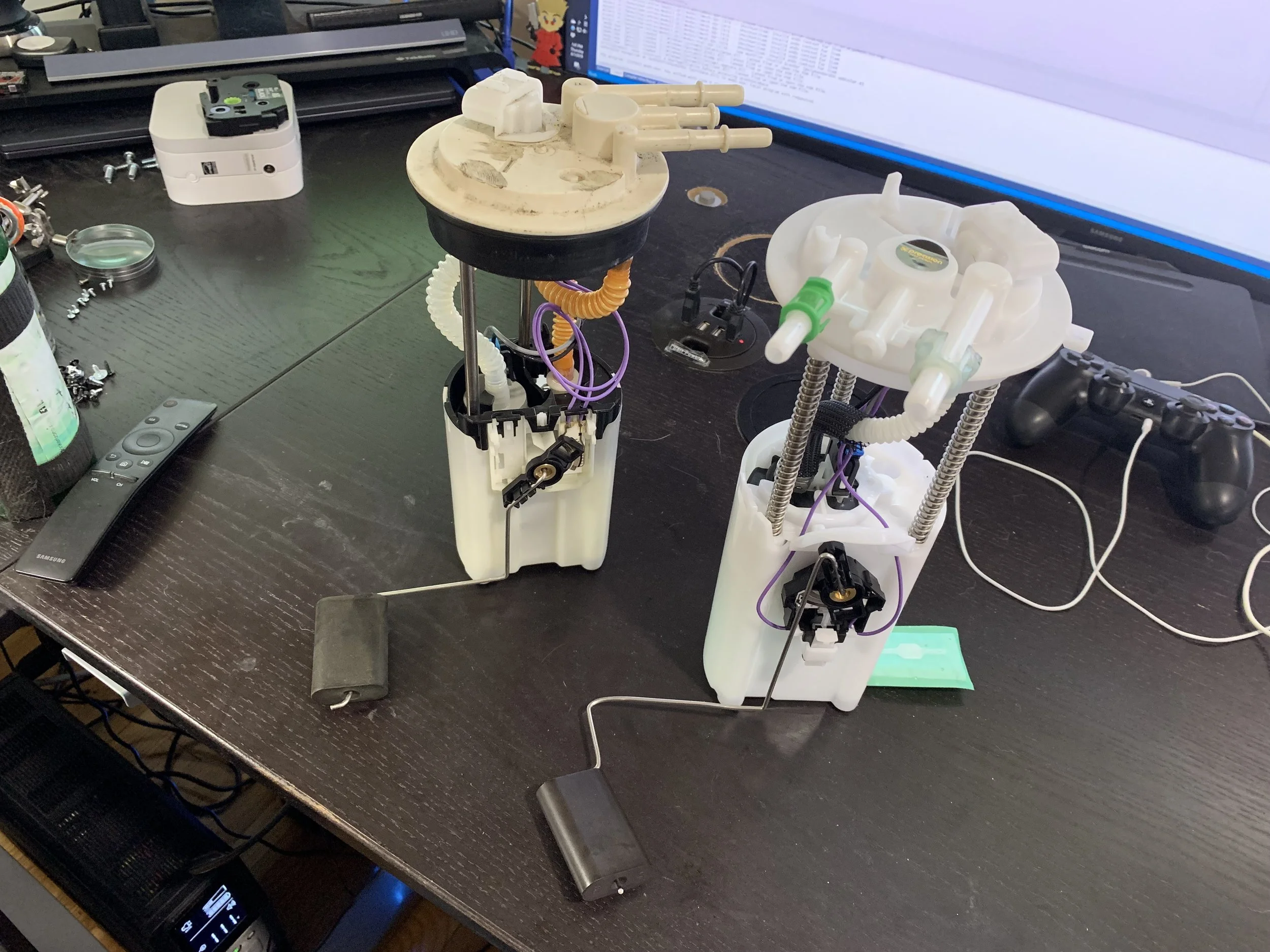 The sender arm after flipping it so that its variable resistor reads the same way the DeLorean one does.