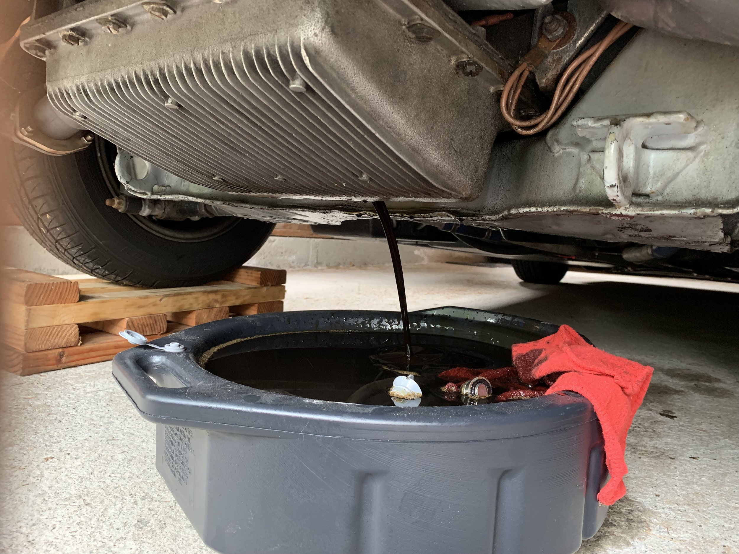 Draining the oil from the engine.