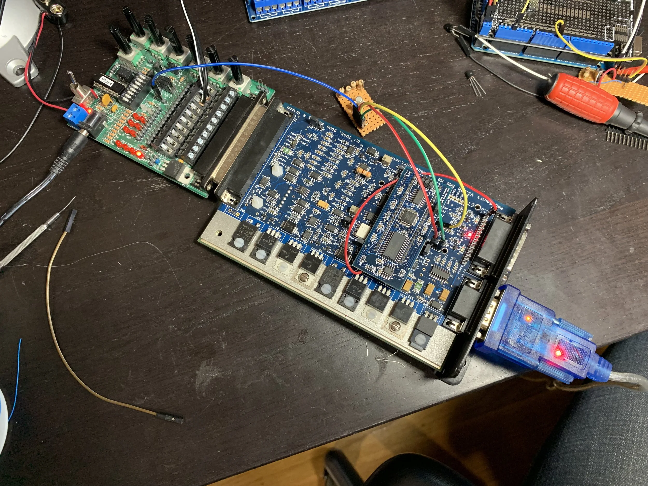 The transistor board being tested with the 5v header from the JimStim. Note that the red wire is tied to the wrong pin on the DB15 at this point. Everything else is correct, though.
