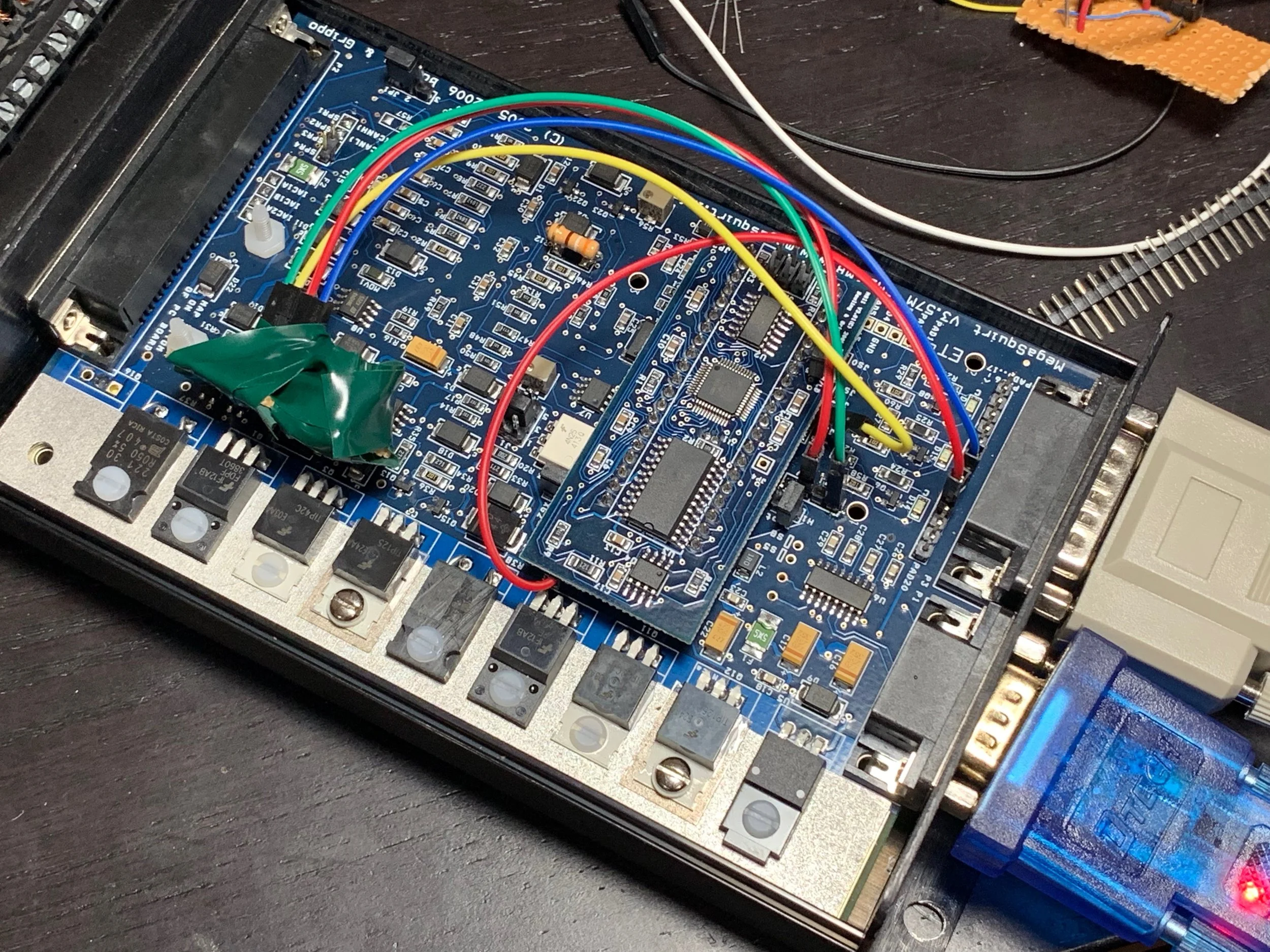 The input circuit wrapped in electrical tape to keep it from touching something unintended on the MegaSquirt board and shorting it out. The red and blue wires are now properly connected for both input and output on the DB15 pins 3 and 4.