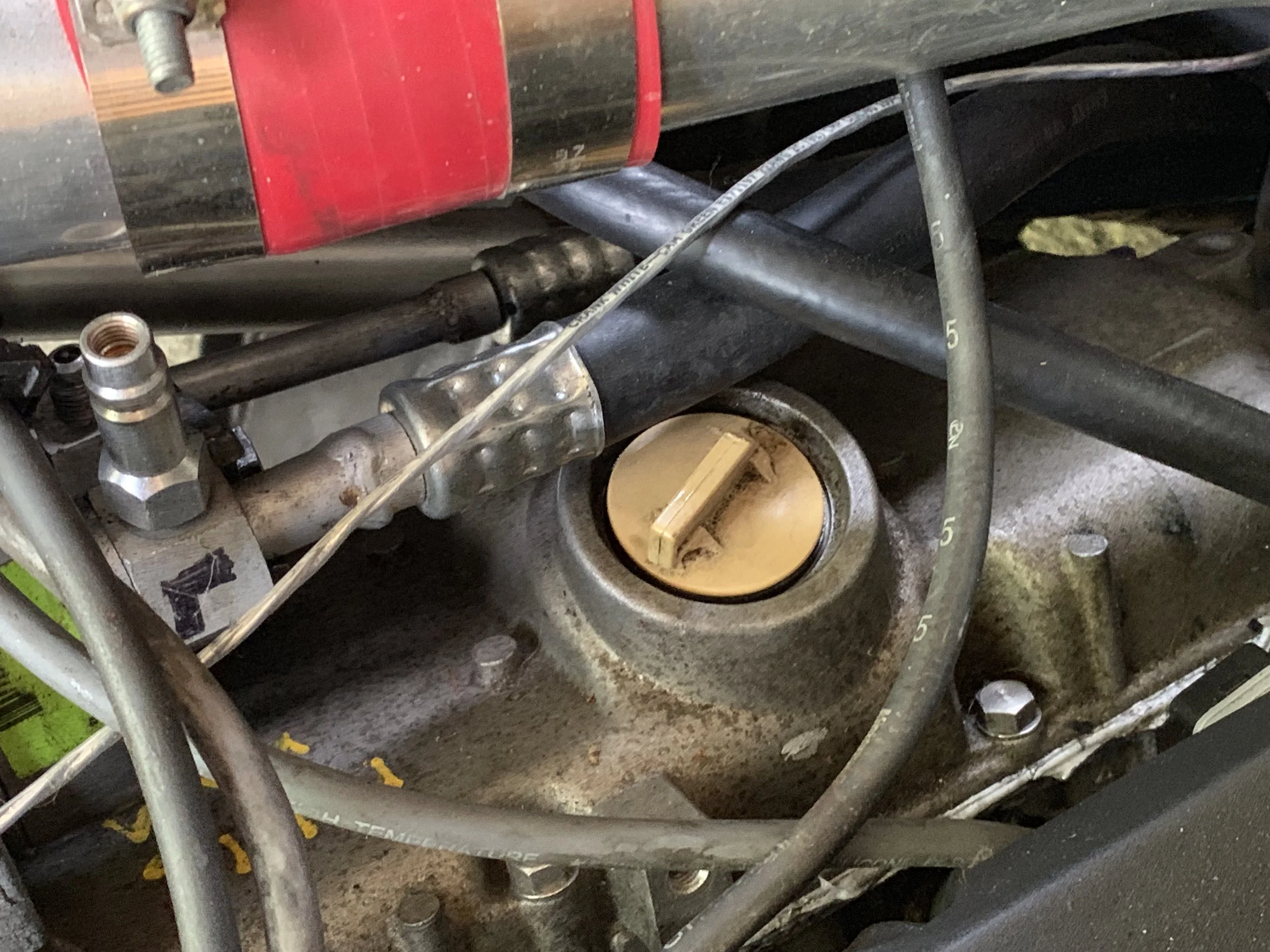 The cut oil filter cap in the closed position.
