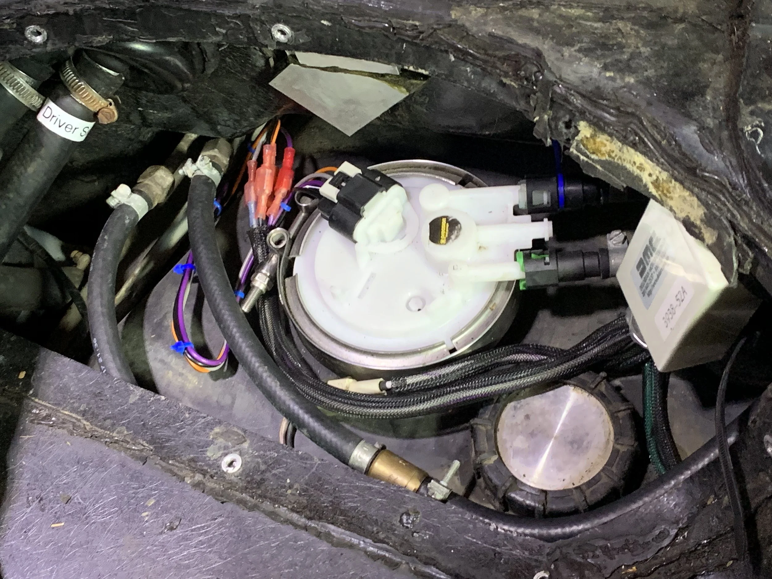Final final installation, with the sender arm pointing more in the direction that the DMCH one would, and the the excess bits of plastic clipped off so the the access cover mostly seats properly.