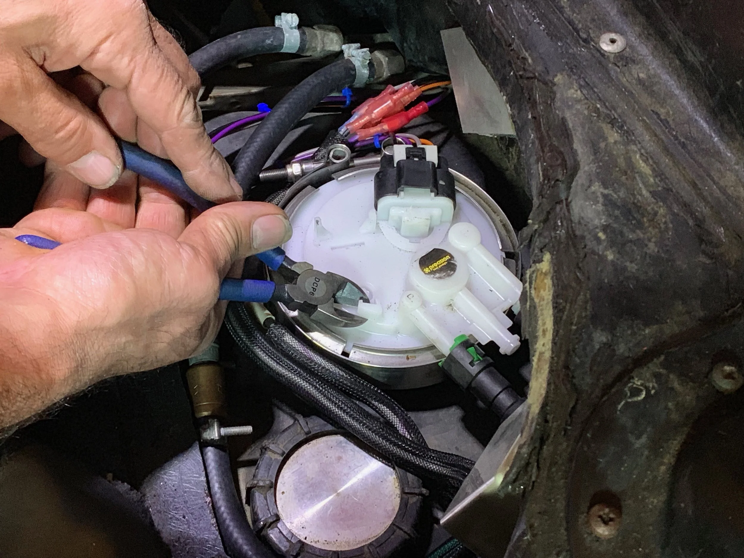 The Tahoe sender re-oriented in a manner similar to the DMCH unit. Two pieces of plastic needed to be clipped off of the top of the sender so that the access panel could be re-installed.
