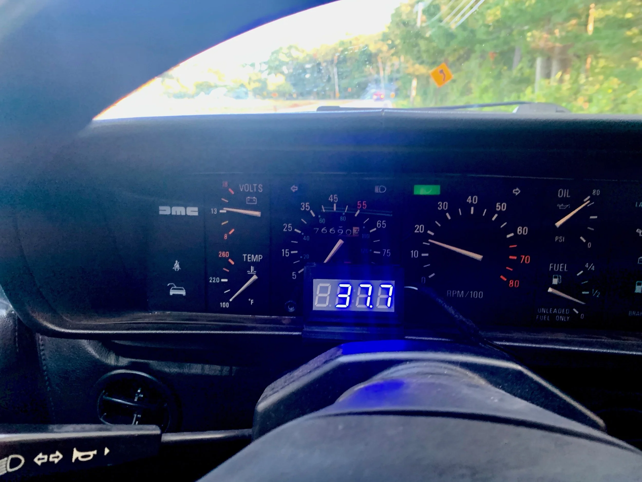 The blue display mounted in the black case with the three-point-one digit software.