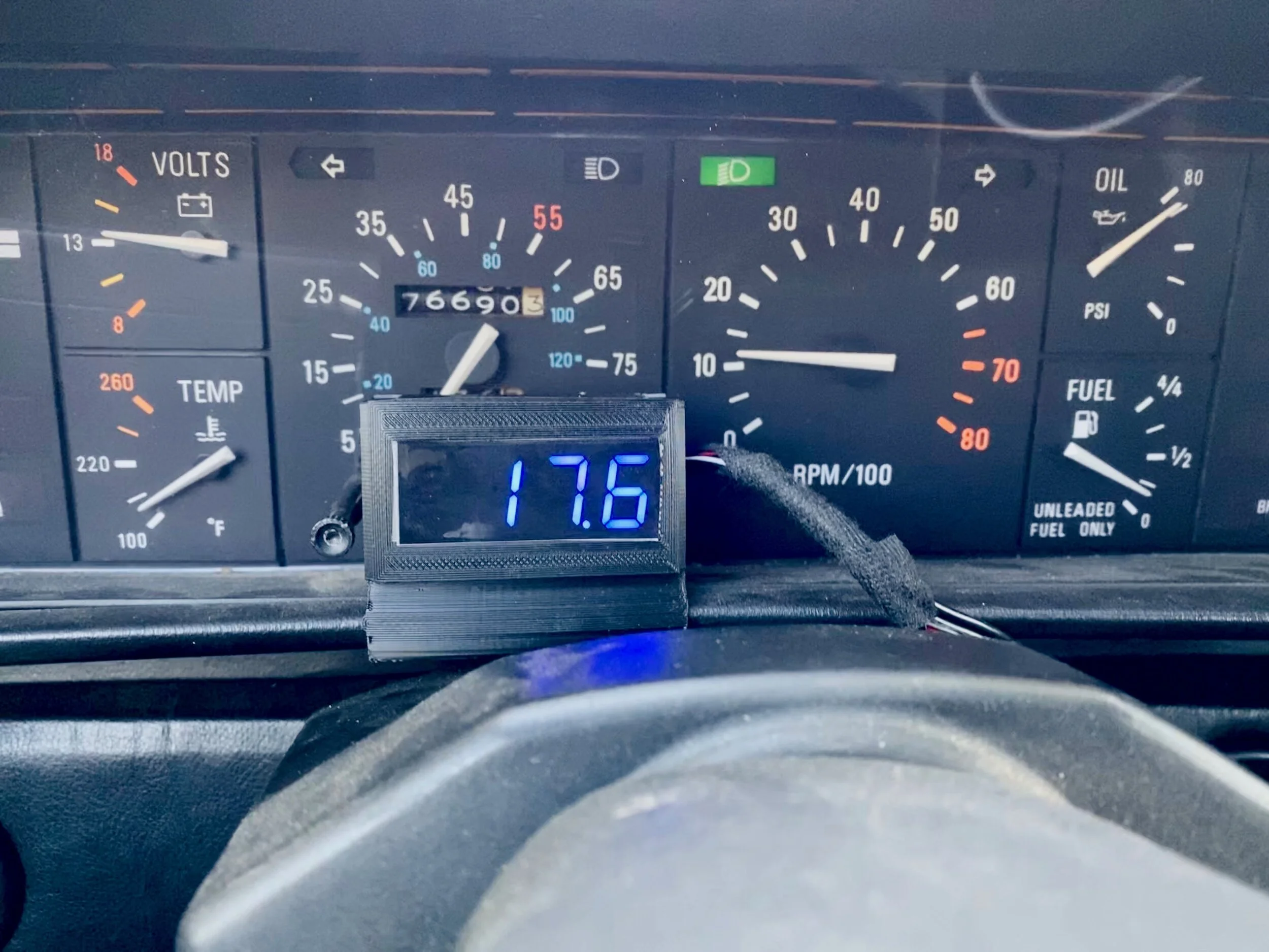 Black dimming film over the display, secured with double-sided tape, makes the screen easily readable in daylight and not blindingly bright at night.