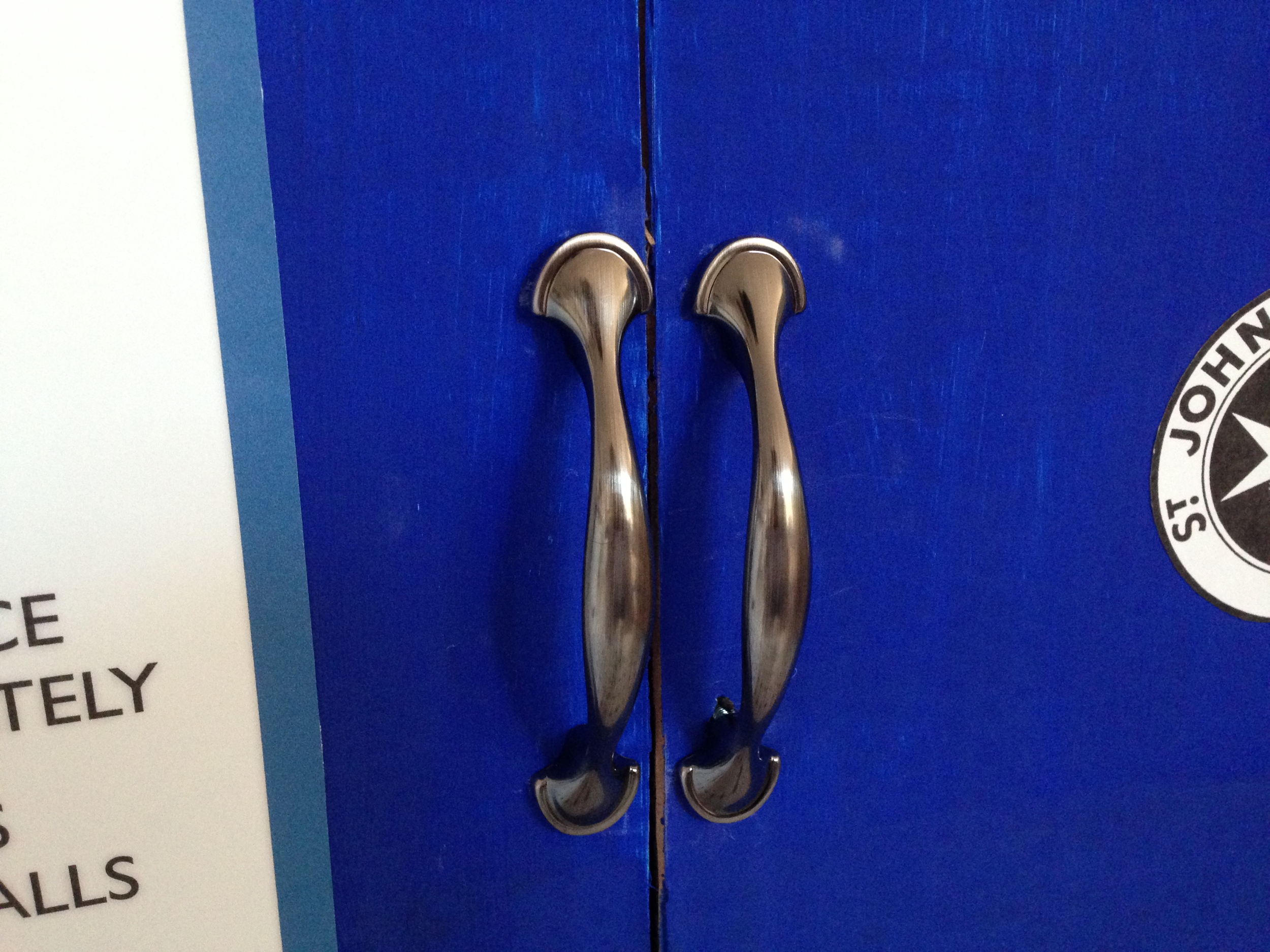 I went with a stock handle with a brushed nickel finish. About $2 each at your local home center.