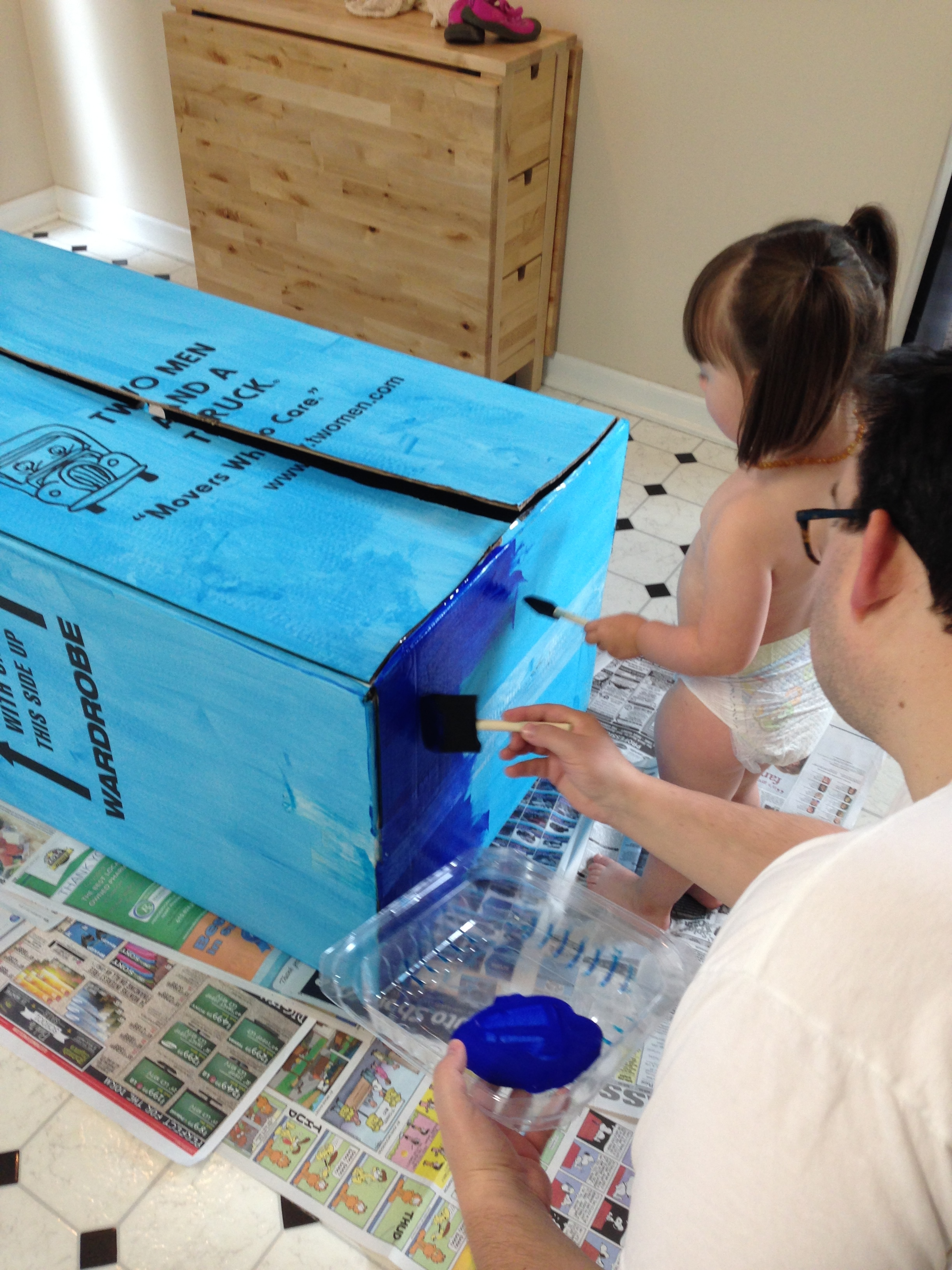 As you can see, we got a much darker blue for the second coat. TIP: Don't worry about your little helper's painting technique. I just let Penelope do whatever and it was way more fun that way. 