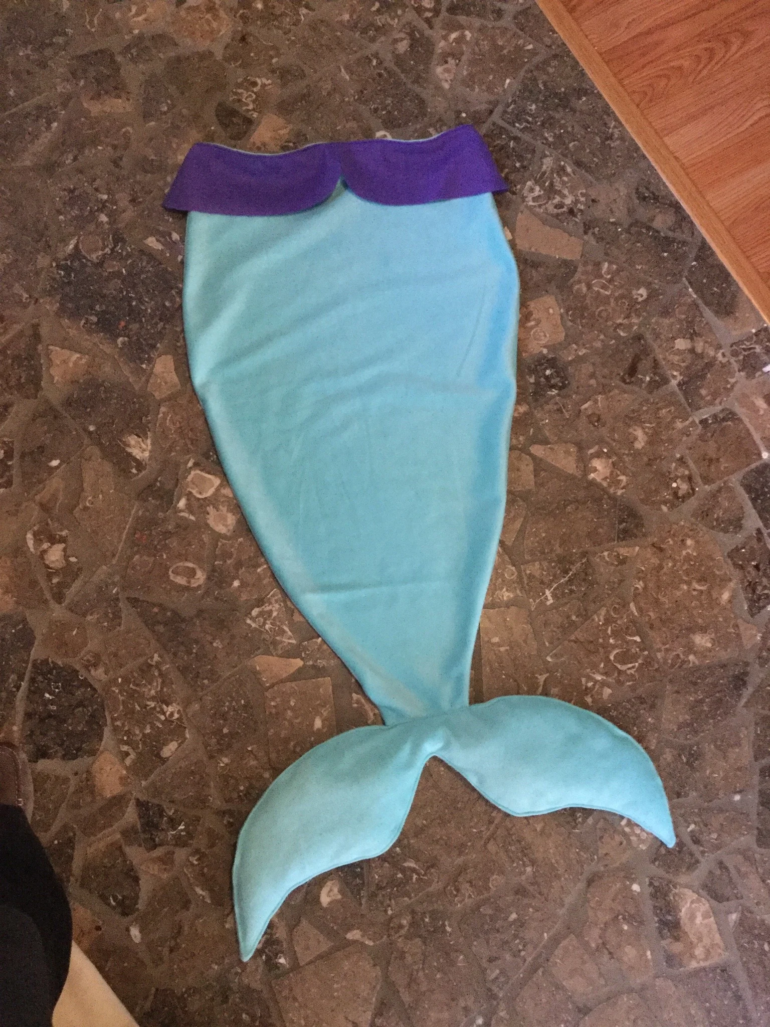 Penelope's new mermaid tail blanket, made by Michelle (aka Mom, aka our sponsor)