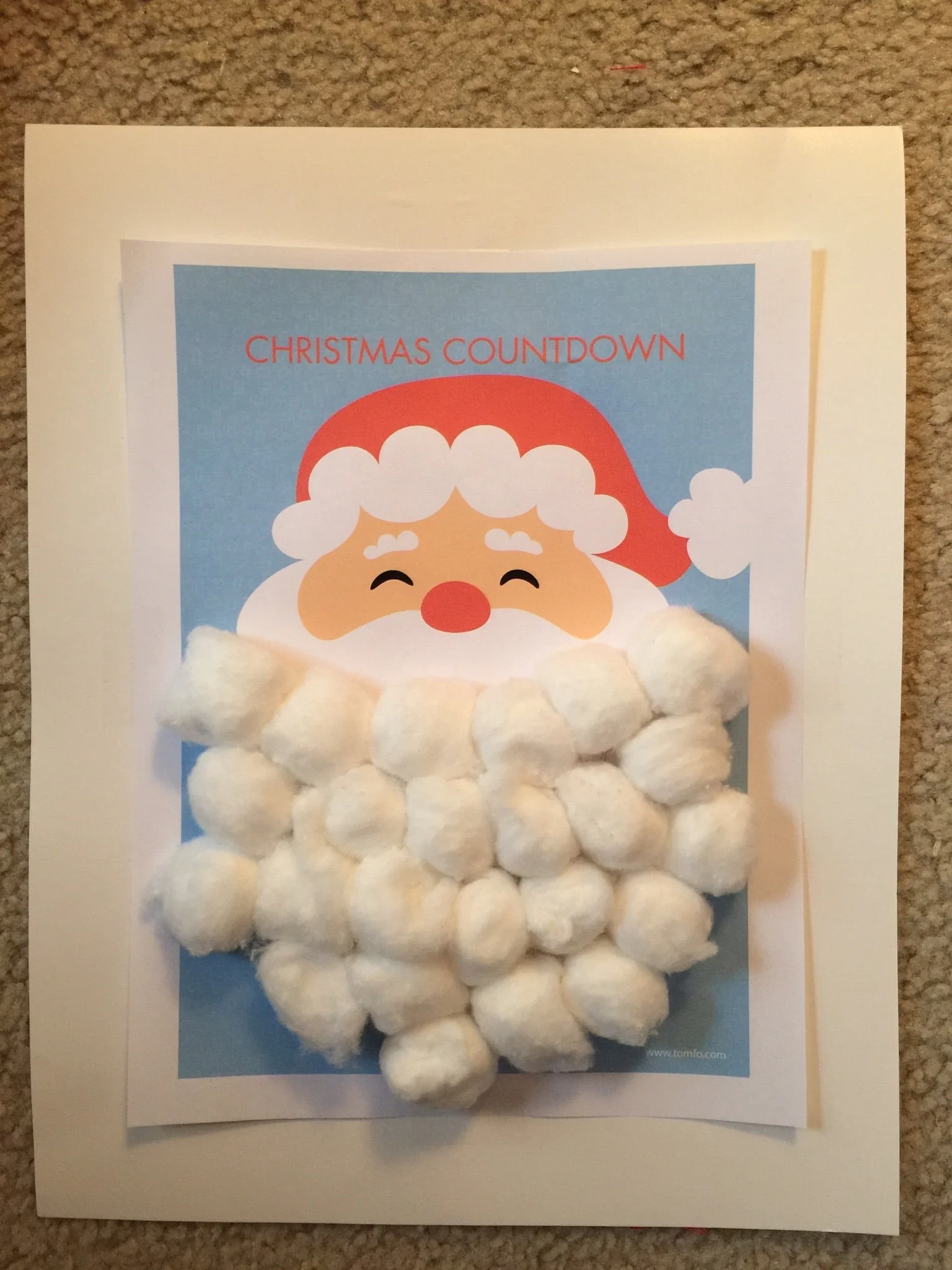 Penelope was very excited to add a cotton ball to Santa's beard every morning