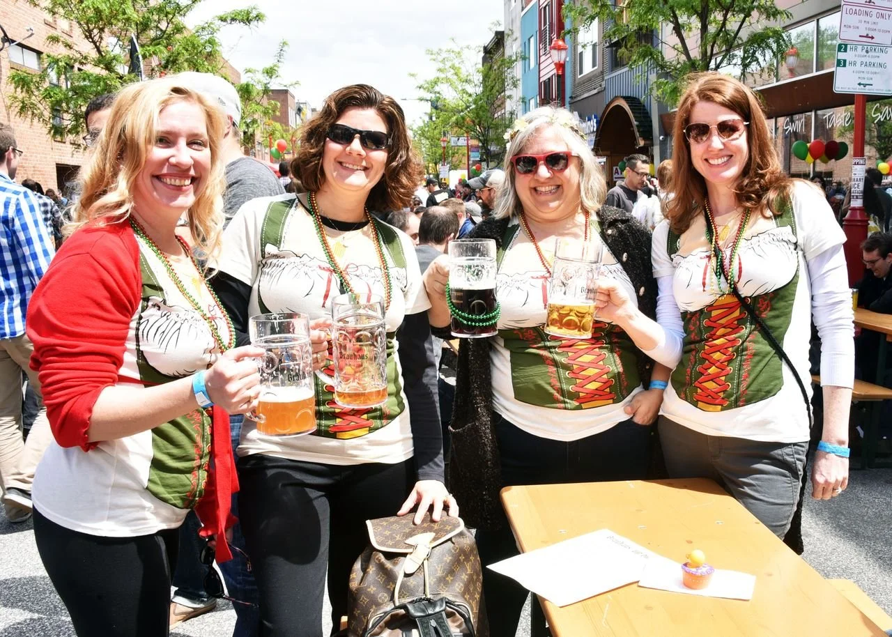 Women drinking beer steins at South Street Maifest Spring Festival