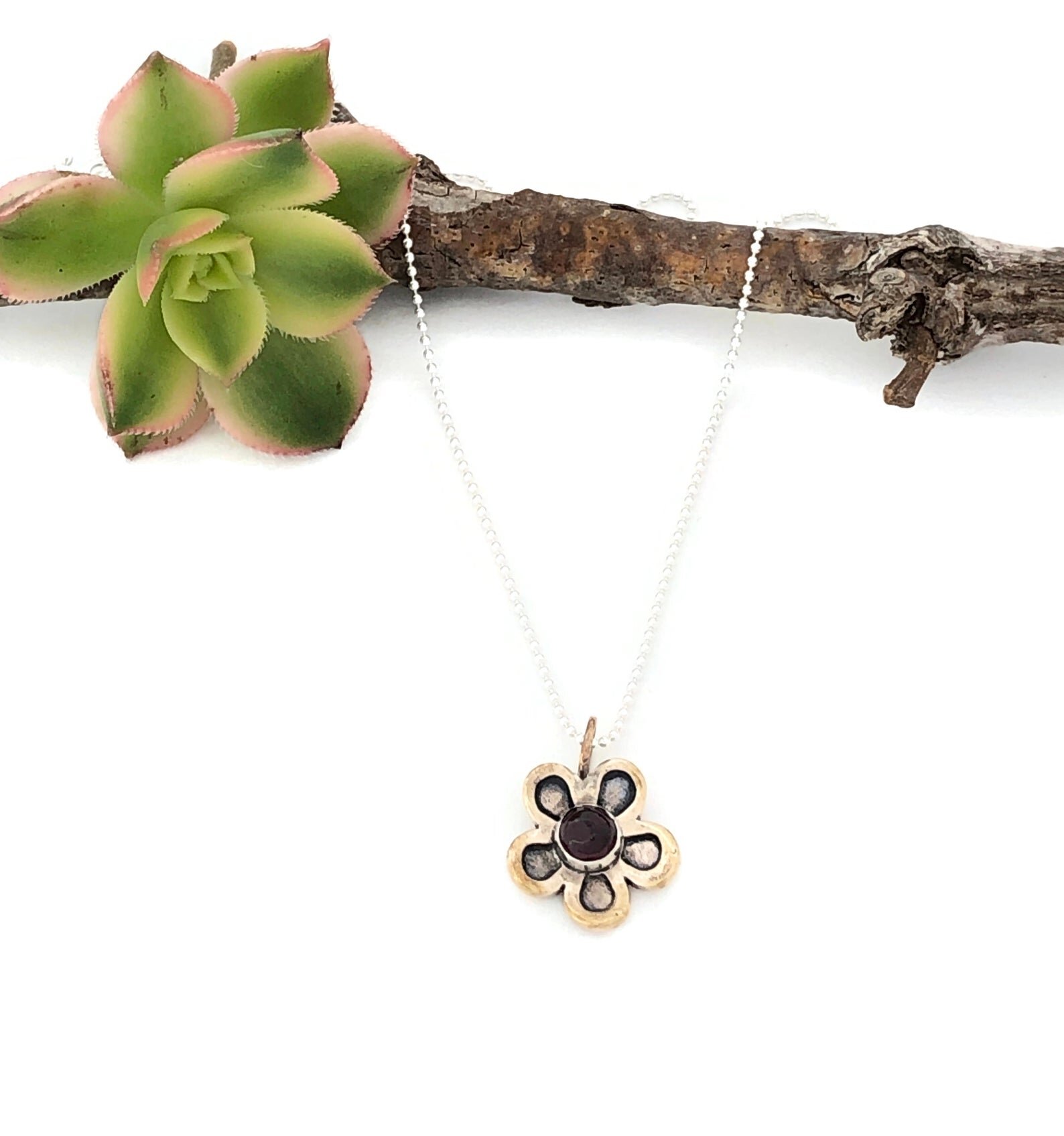 Flower Bronze and Garnet Pendant