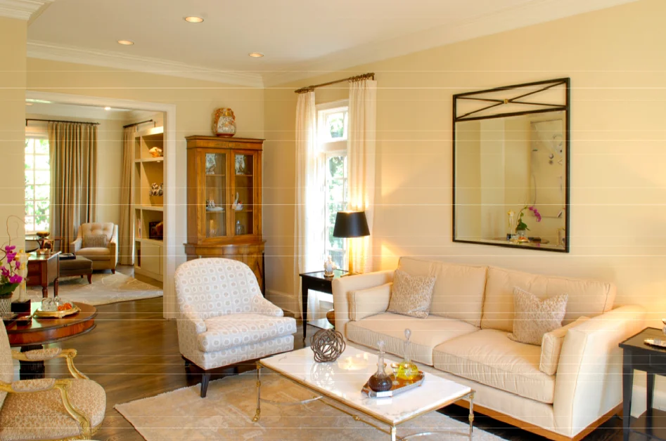 The client's house was decorated in a traditional manner and she wanted to make her home more transitional. The furnishing layout was re-arranged and new items such as the rug, sofa, end tables, lounge chairs, mirror, lamps and drapery were incorporated with items already owned. The single chair was re-upholstered with a Nancy Corzine modern patterned velvet. 