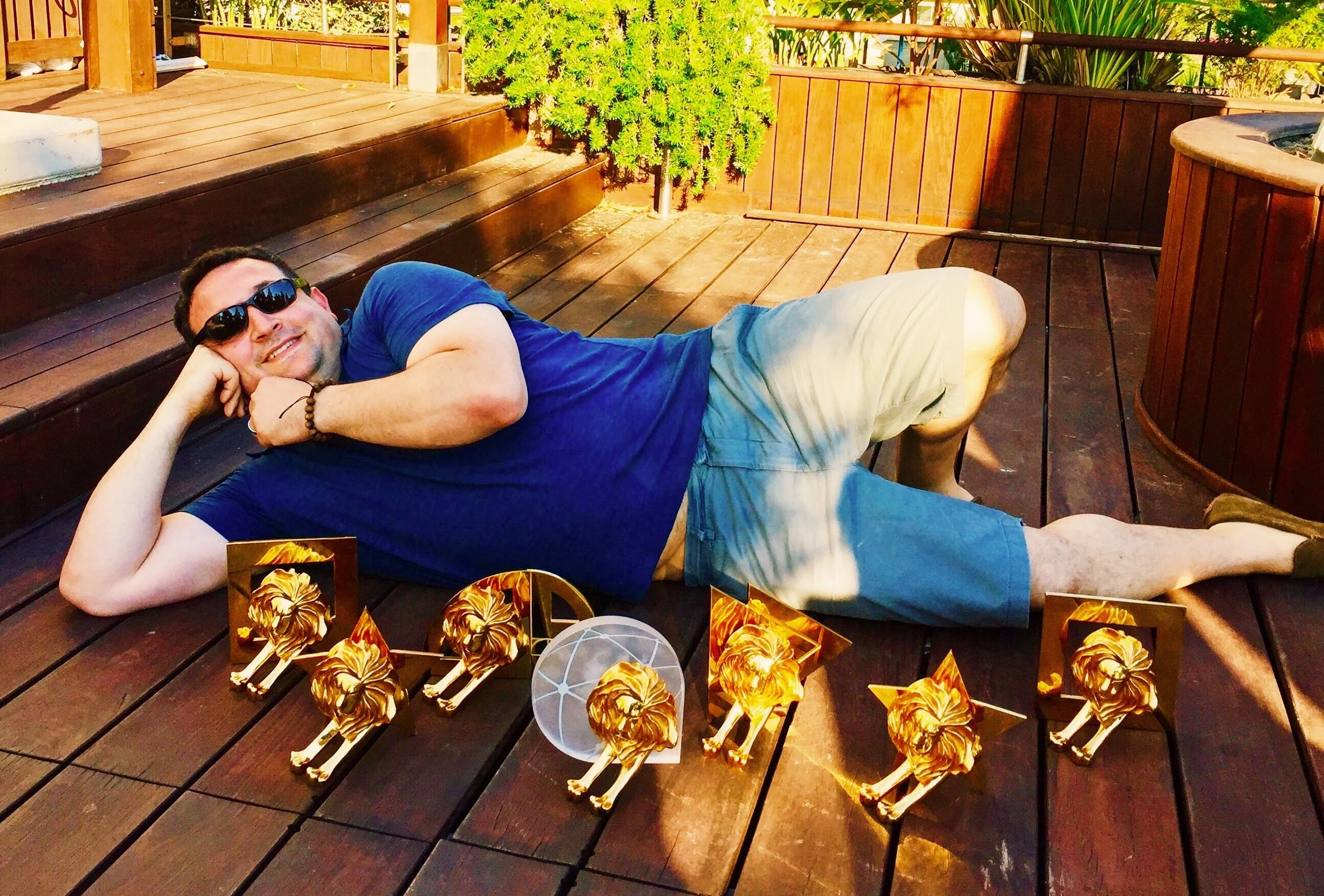 JOSH LAYS WITH LIONS CROP1.JPG