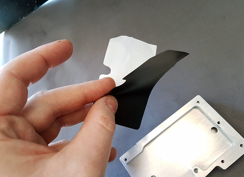 Peeling of adhesive backing