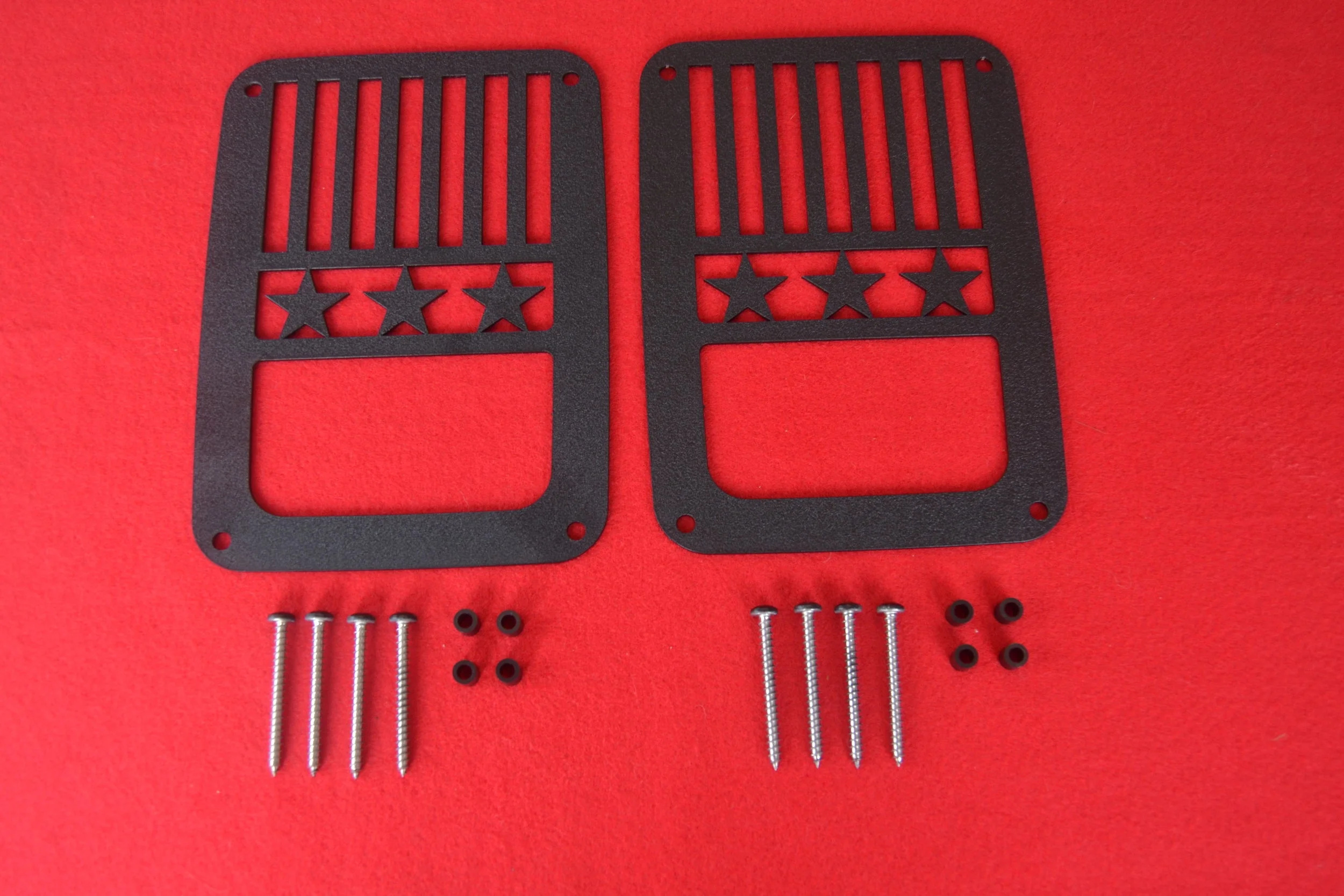 BLACK JK (2007-PRESENT) JEEP STARS & STRIPES DESIGN SHOWN ABOVE.THIS TAILLIGHT GUARD IS REVERSABLE.