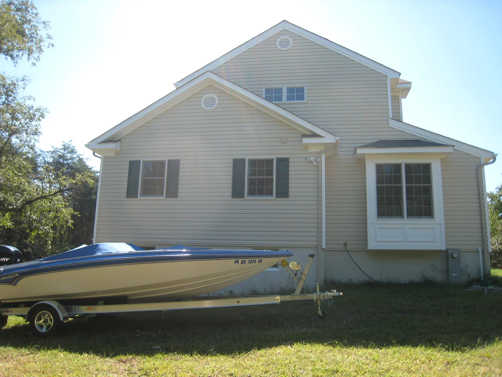 After: the owners' boat now fits in the basement level storage bay, accessible from the rear.