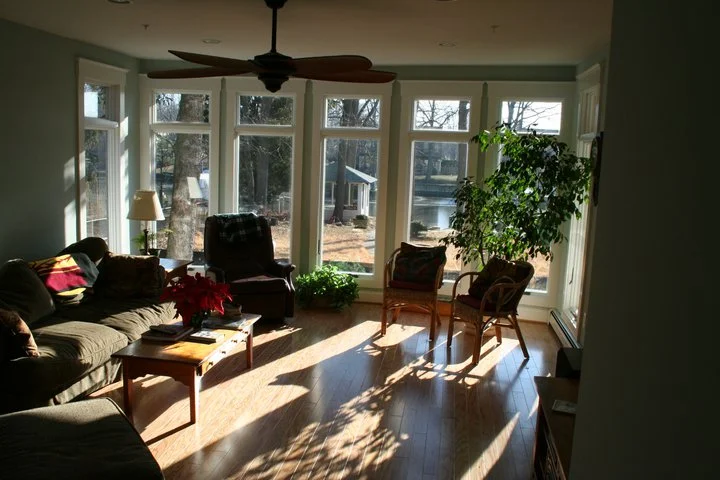 After: the existing slab was removed for the family room and repoured 7" lower to provide a ceiling high enough for windows with transoms at the back. The bit of family room that's in the new addition was built over a new small crawlspace. The morning light in this room, along with the view, should be featured in a Folger's commercial.