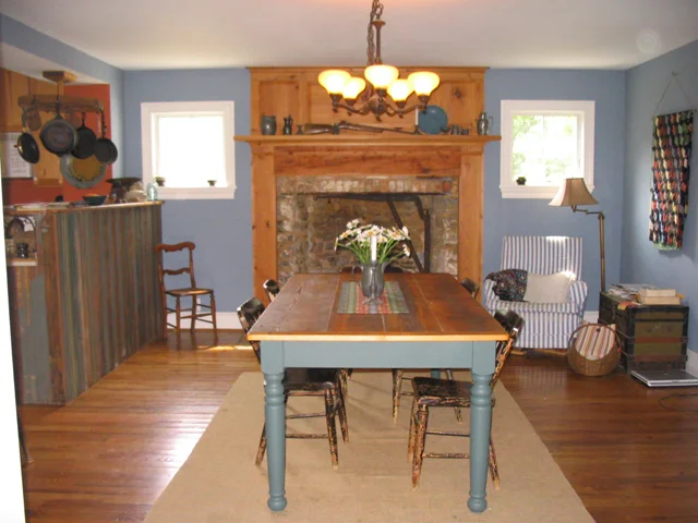 After: this used to be the kitchen! The windows flanking the fireplace are new. The fireplace is original and was concealed behind old kitchen cabinets.