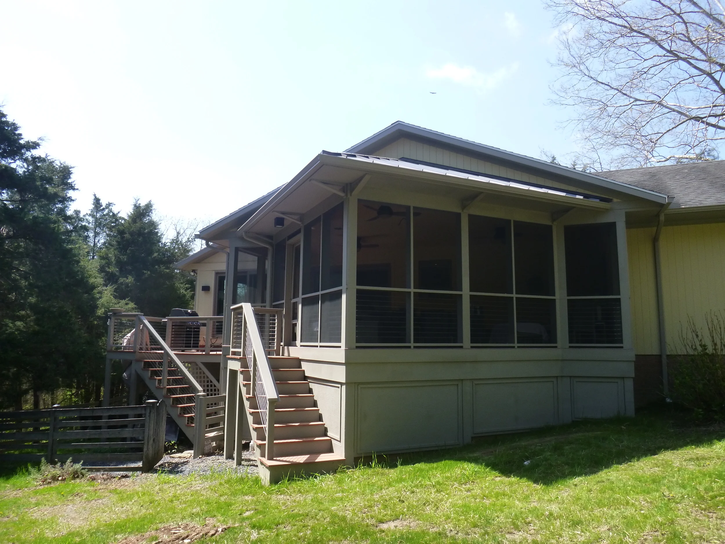   This contemporary screened porch addition goes with the Porcelanosa kitchen renovation.  