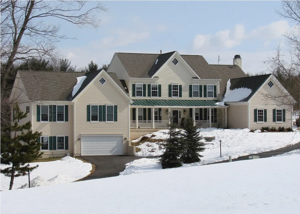 Two-story in-law addition with garage beneath