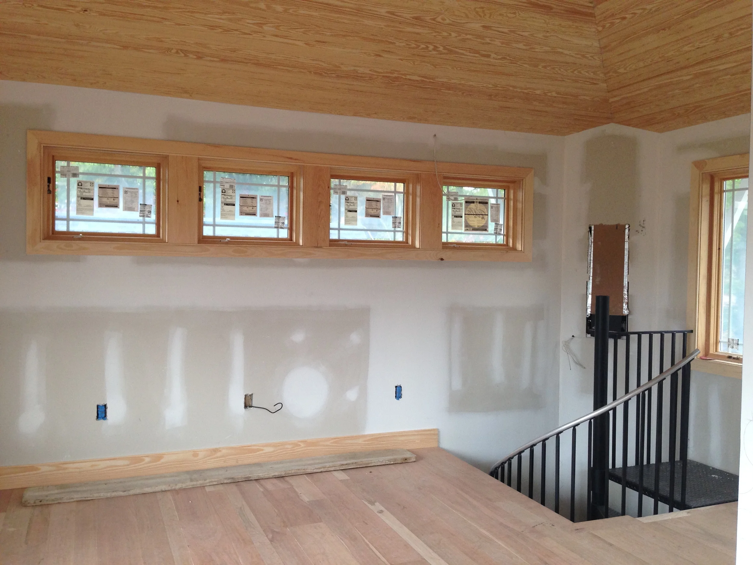  I love how the angled enclosure for the tiny fireplace, behind the spiral stair of the tower, creates an interesting geometry with the sloped ceiling. 