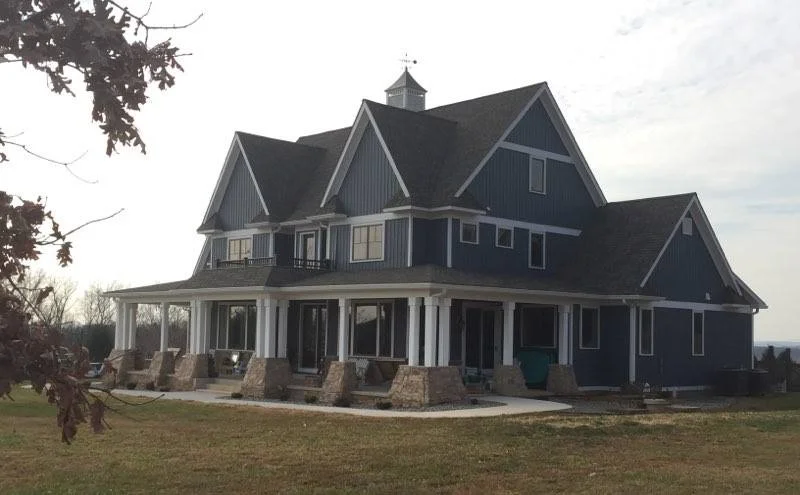 Blue Farmhouse on the Hilltop