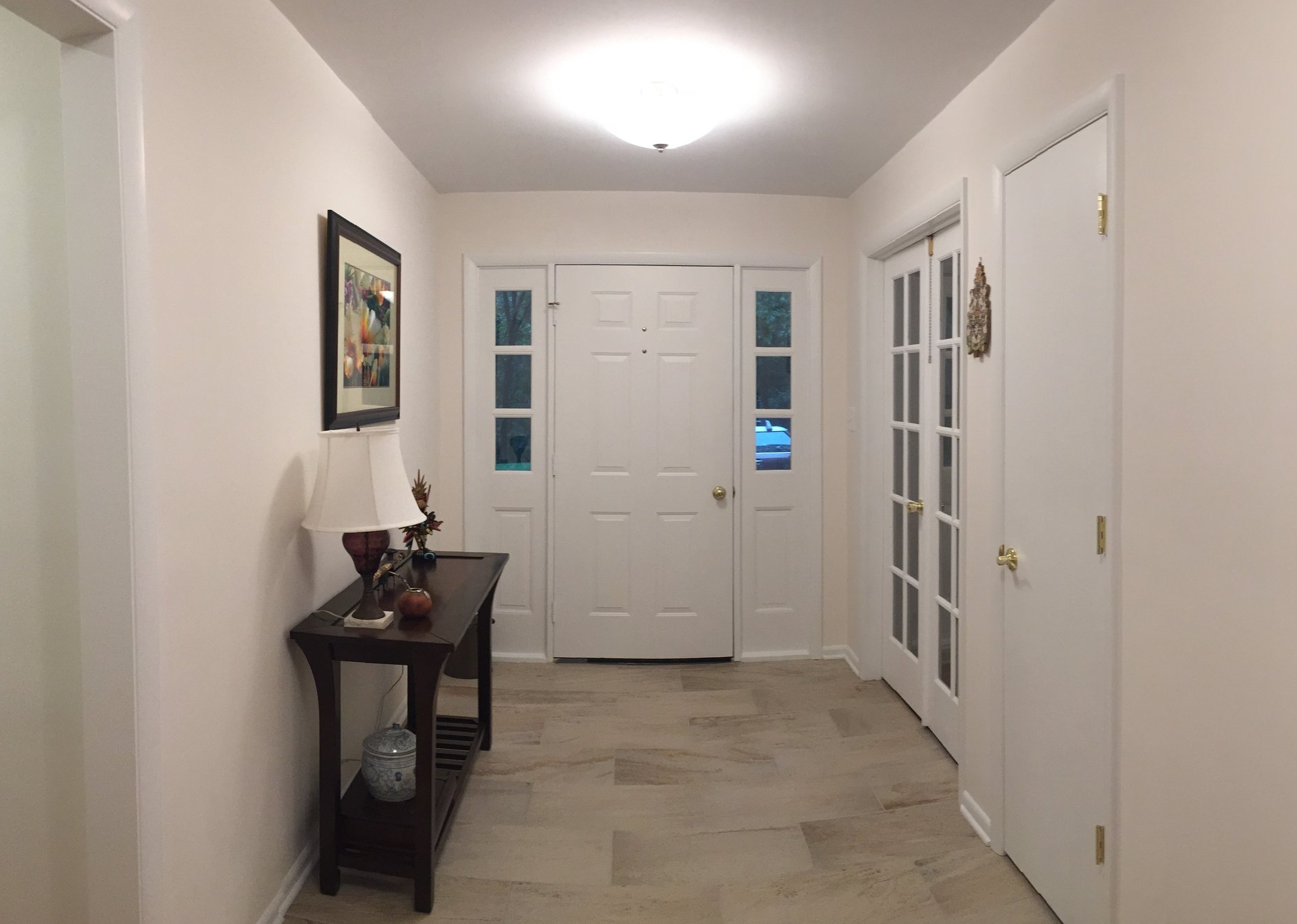 After, the coat closet and wall were removed for an open flow between the Foyer and the rest of the house.&nbsp; A new coat closet next to the double French doors was carved out of a corner of the Family Room.&nbsp; The French doors were also rehung