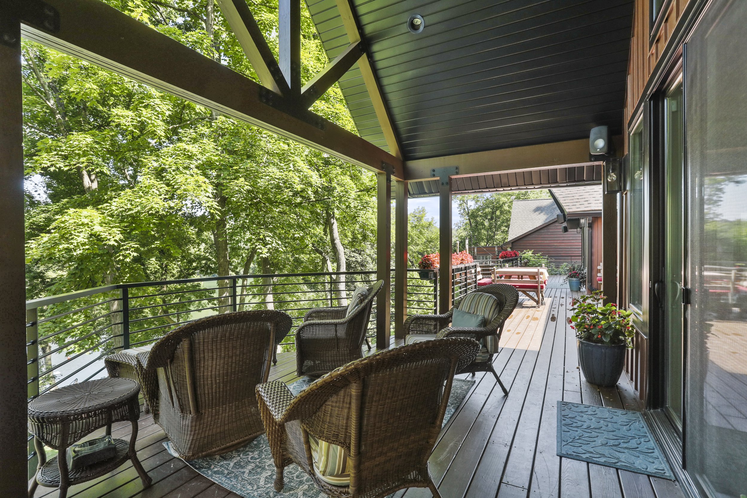  Original deck was expanded to continue across the back of the new construction. This covered bit of deck feels like an outdoor room and gets lots of use. 