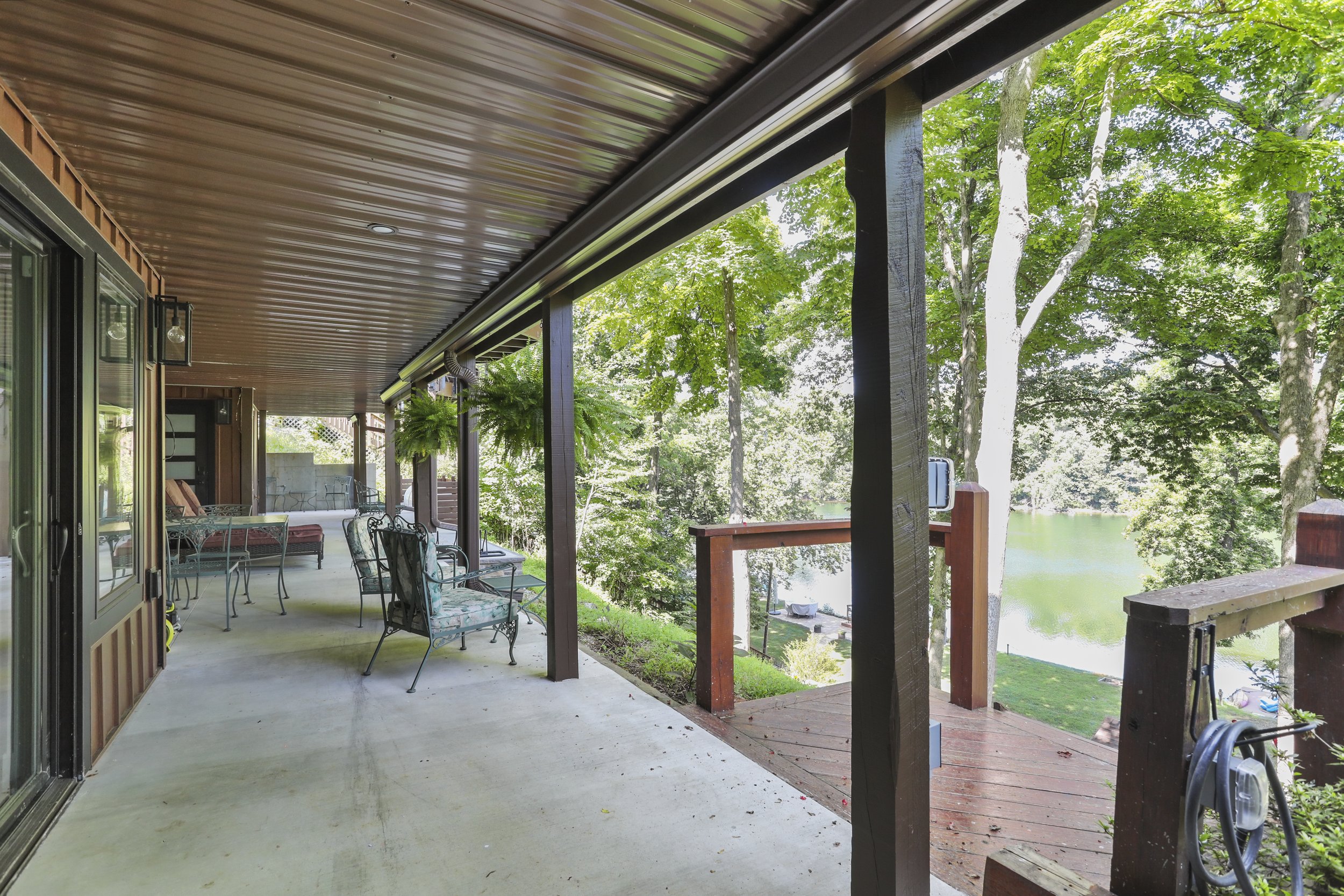  Space under the original and expanded deck was finished with structural slabs, where previously there had been old flagstones and gravel.  What an improvement! 