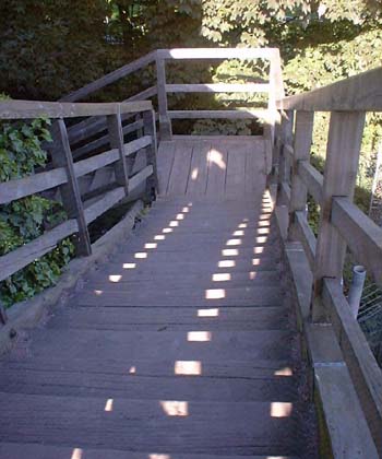  Wooden footbridge construction going down 