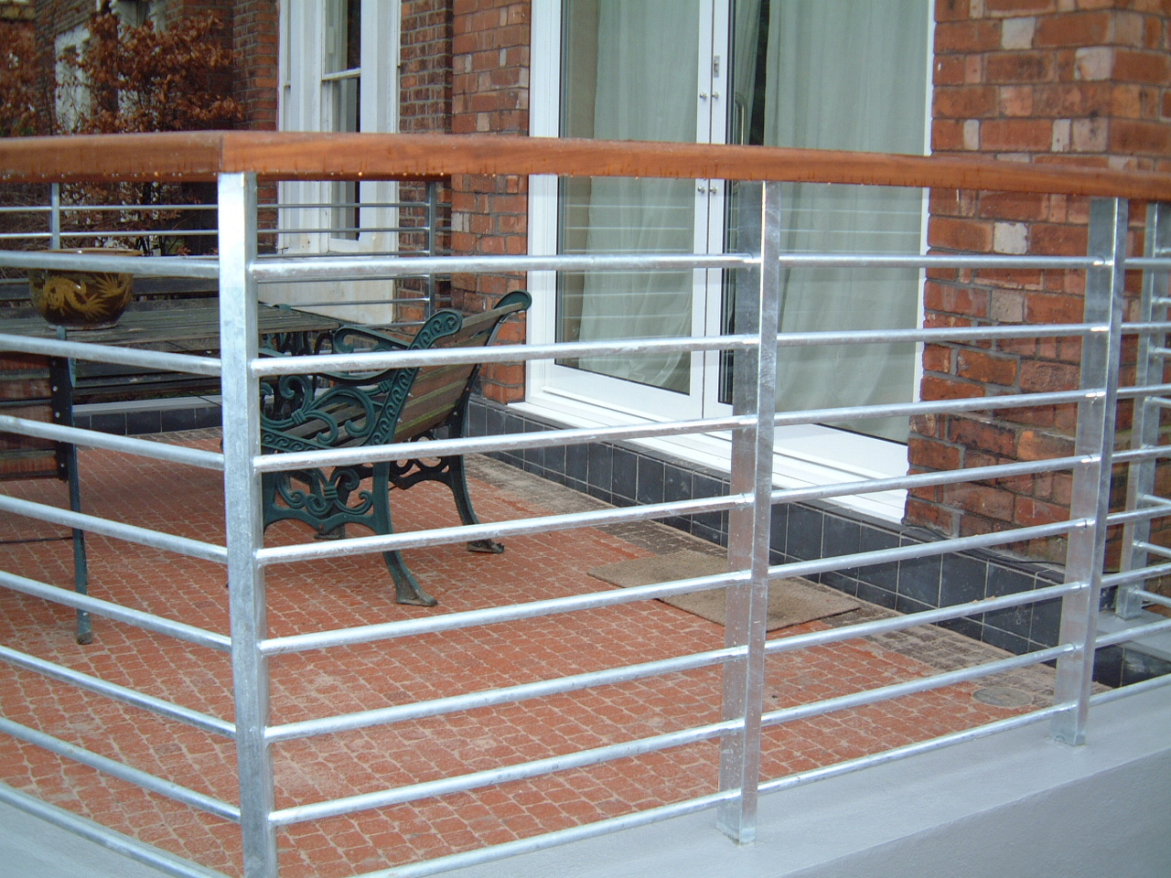  Steel rail with wooden handrail 