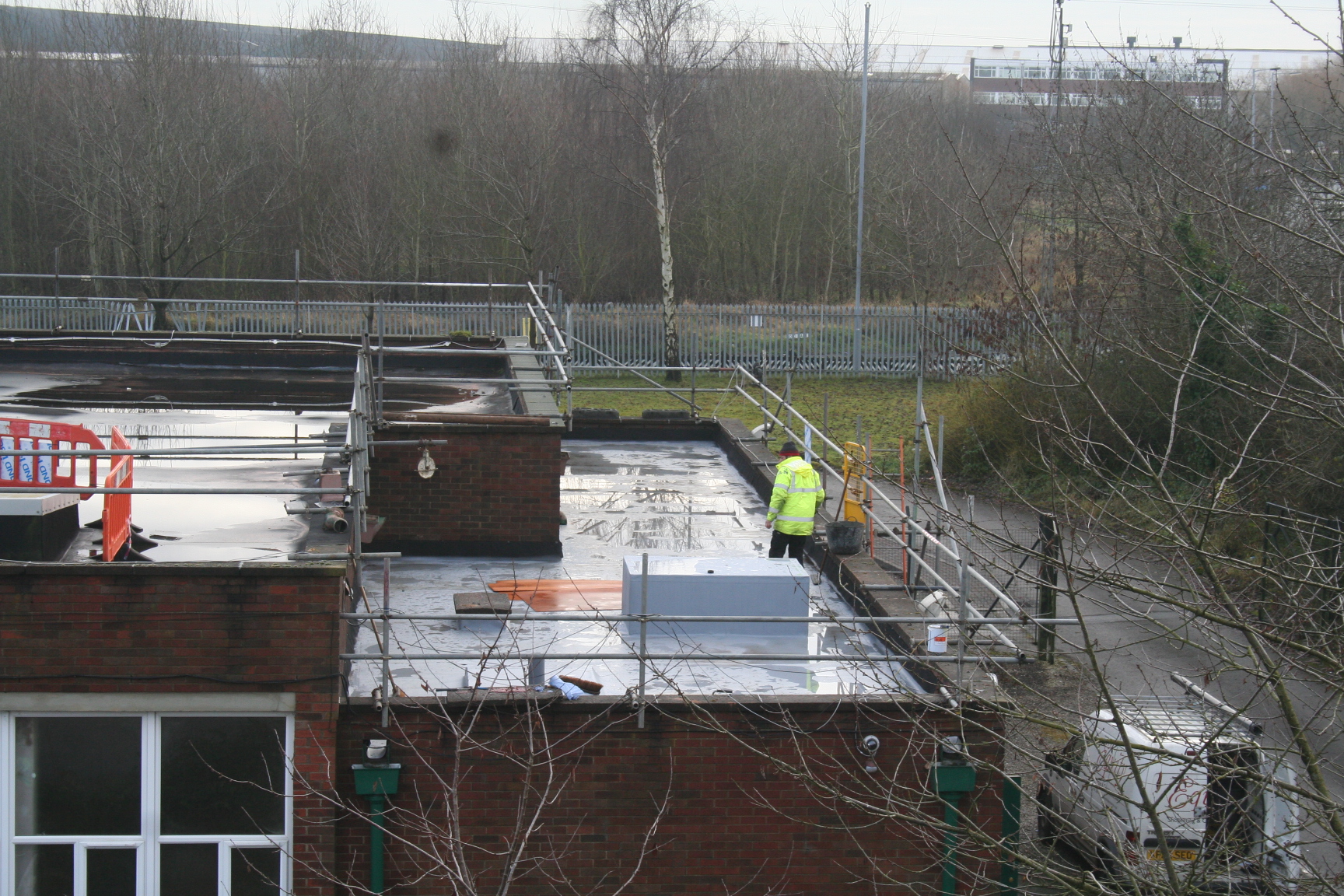  Equity construction staff working on roof 