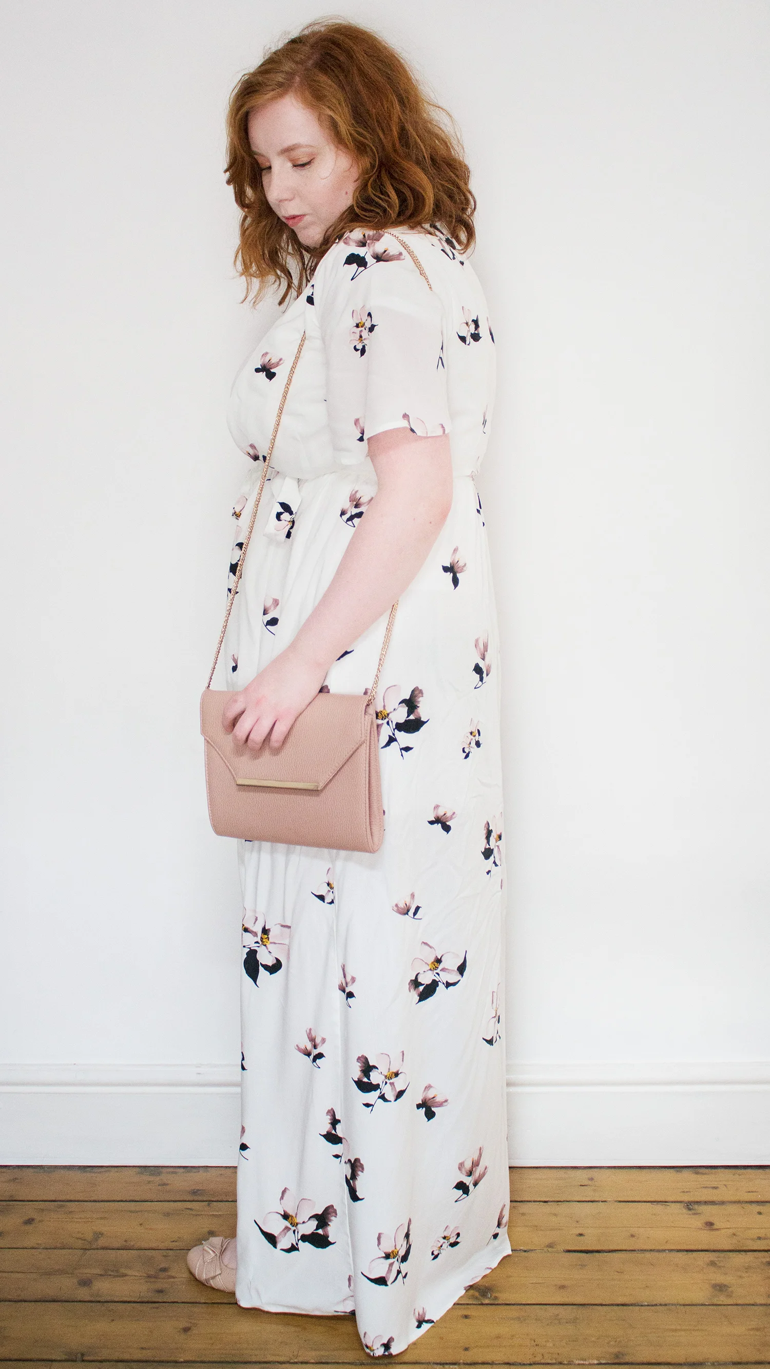 Woman in white floral maxi dress