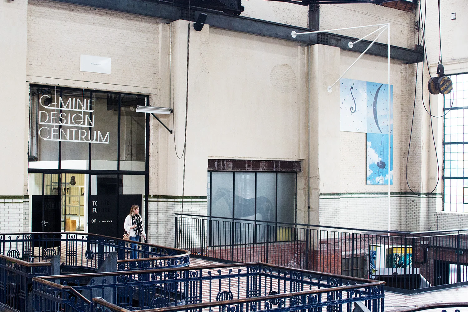 Person walking through C-mine in Genk, through the Design Centrum