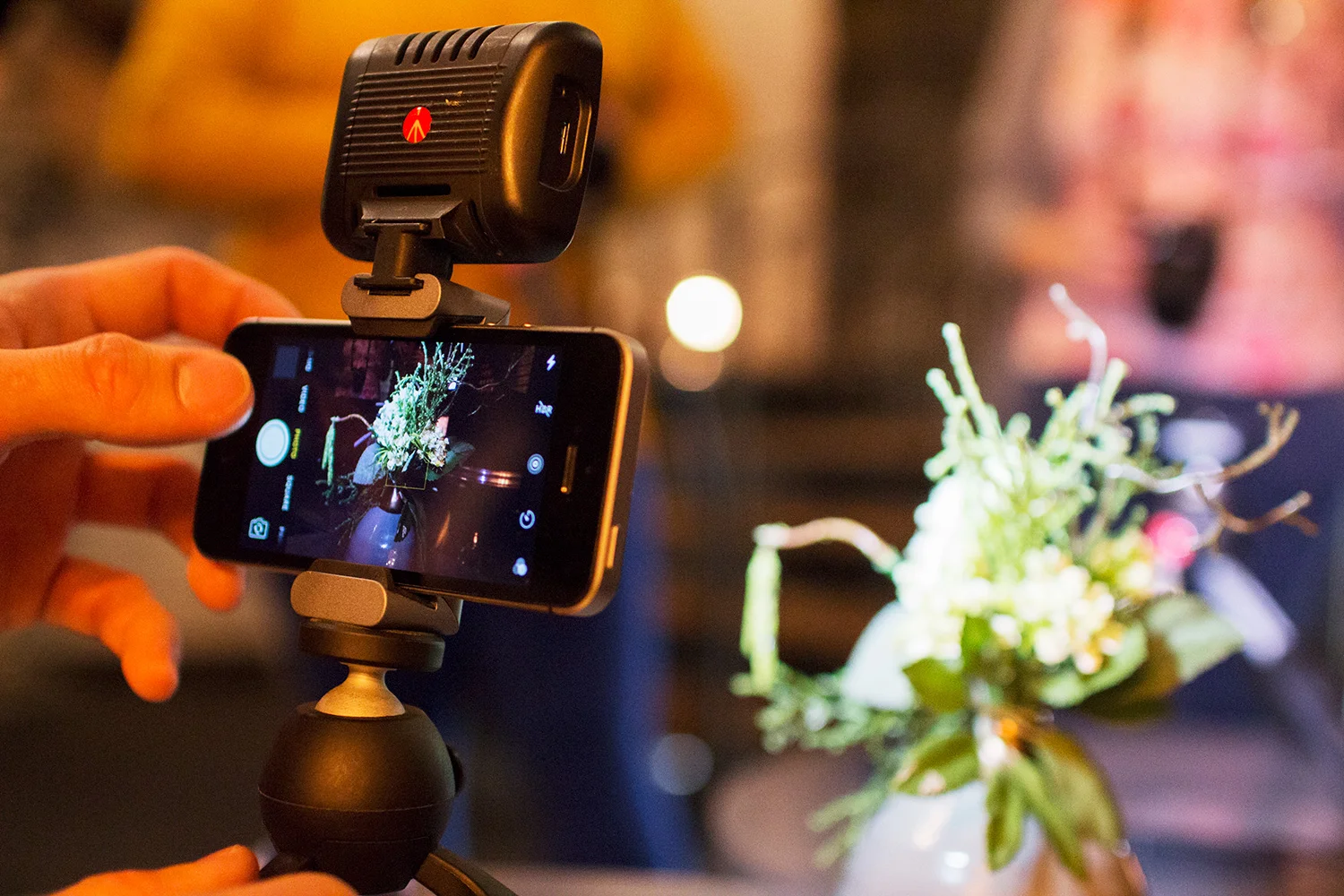 Manfrotto Mini Tripod with Universal Smartphone Clamp with an iPhone.