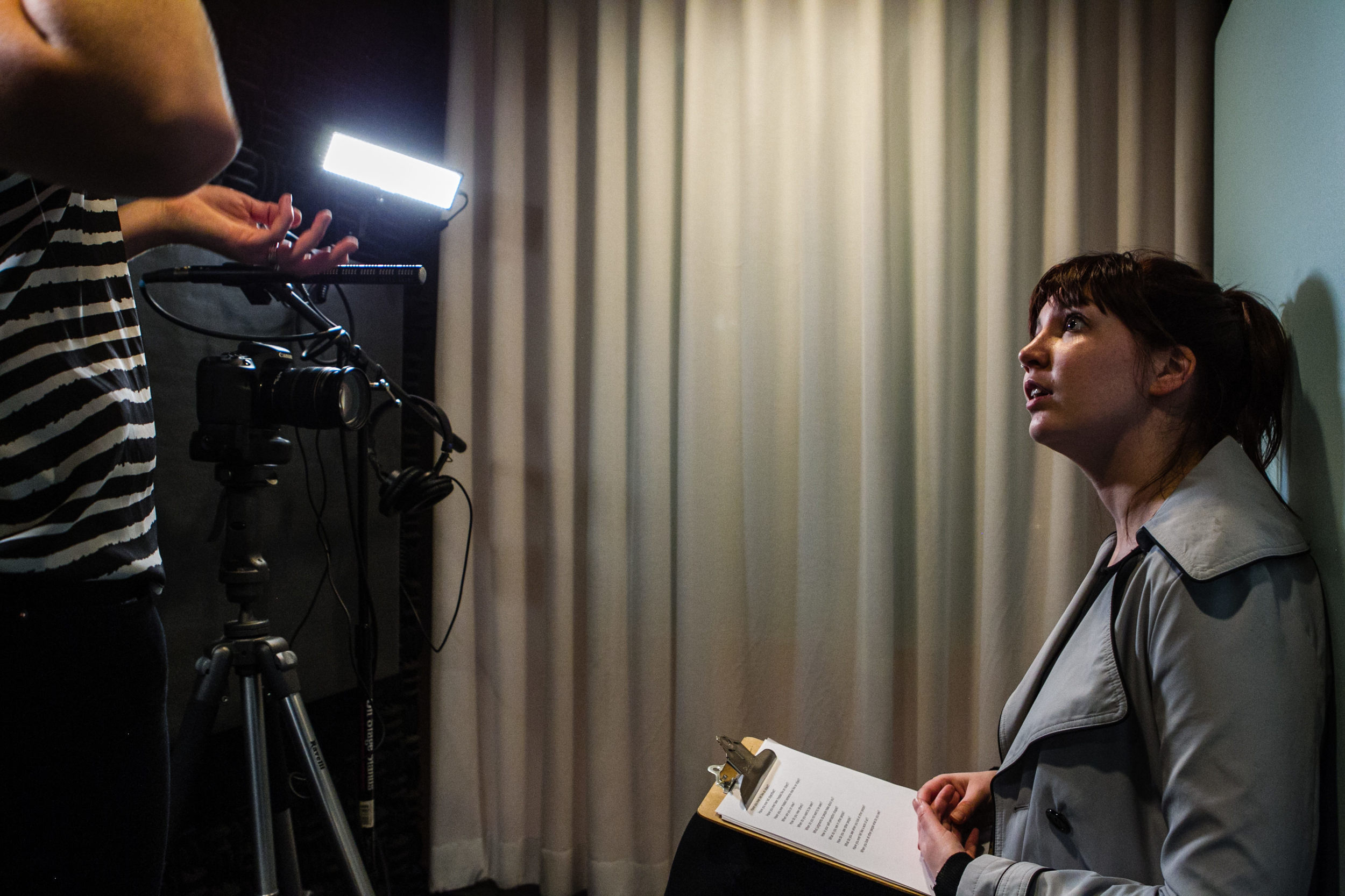  One of the participants with the prompts in hand as I give her instructions for the recording. 