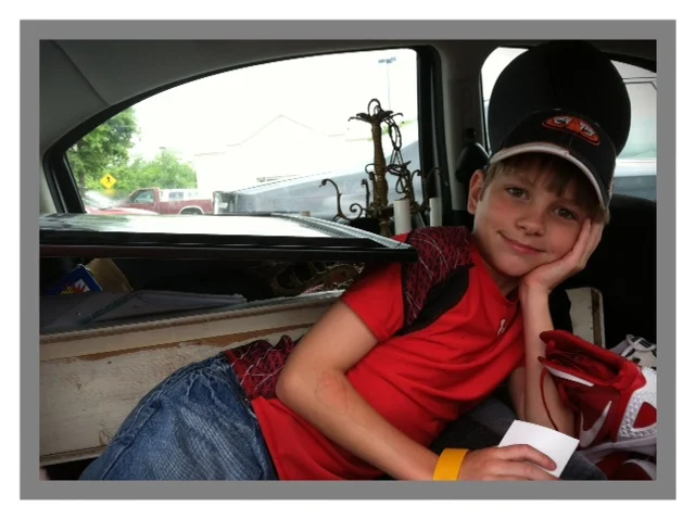 This picture proves 2 things I have told y'all. 1.)It's in our DNA. Both of my boys, have no problem getting up at 5 or 6 am for a yard sale trip. 2.) Hunter just goes with the flow. The last trip he had to ride home like this. He never complained!