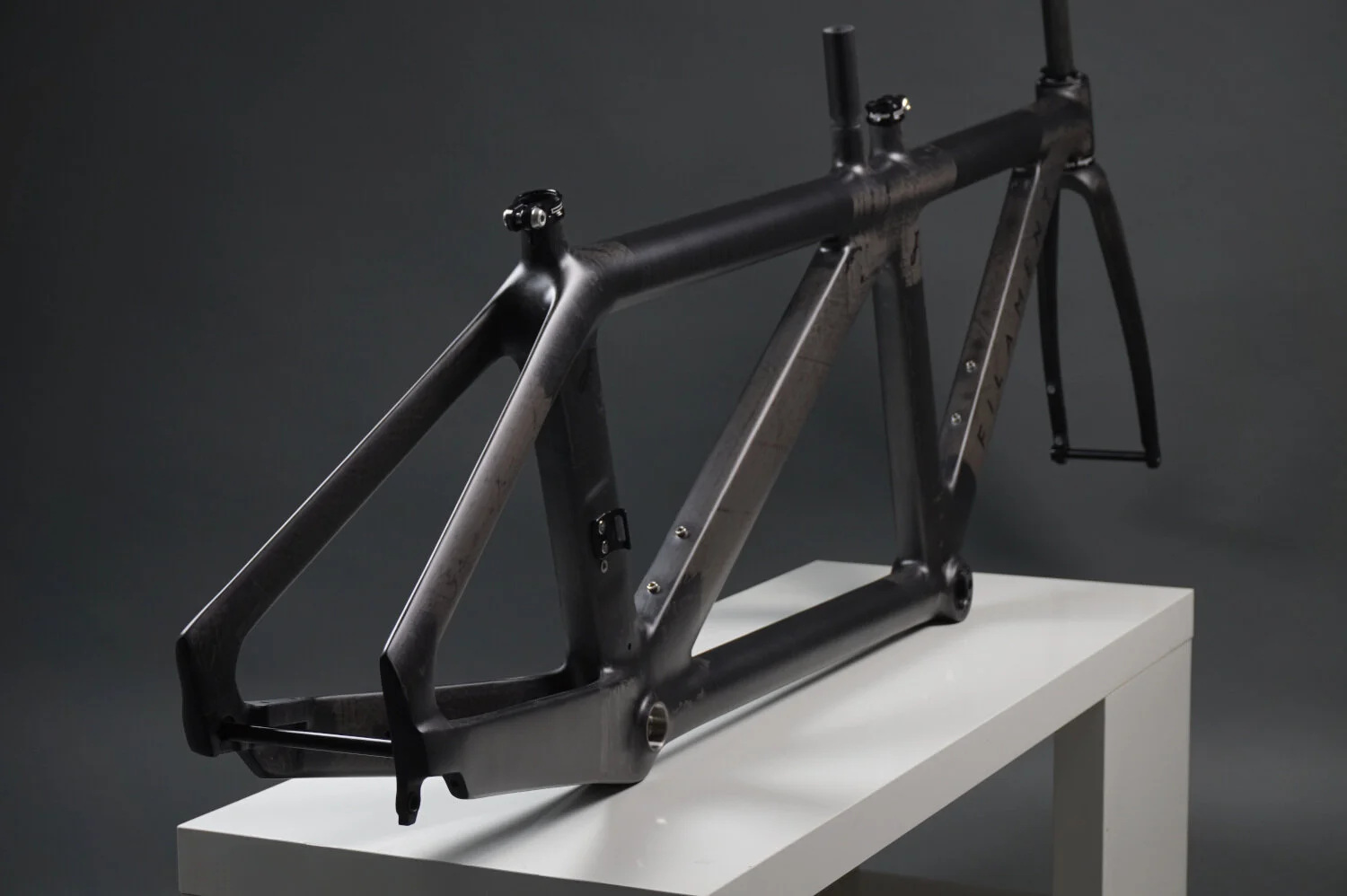 Rear view image of a Filament aero TT frame with clearcoat finish.