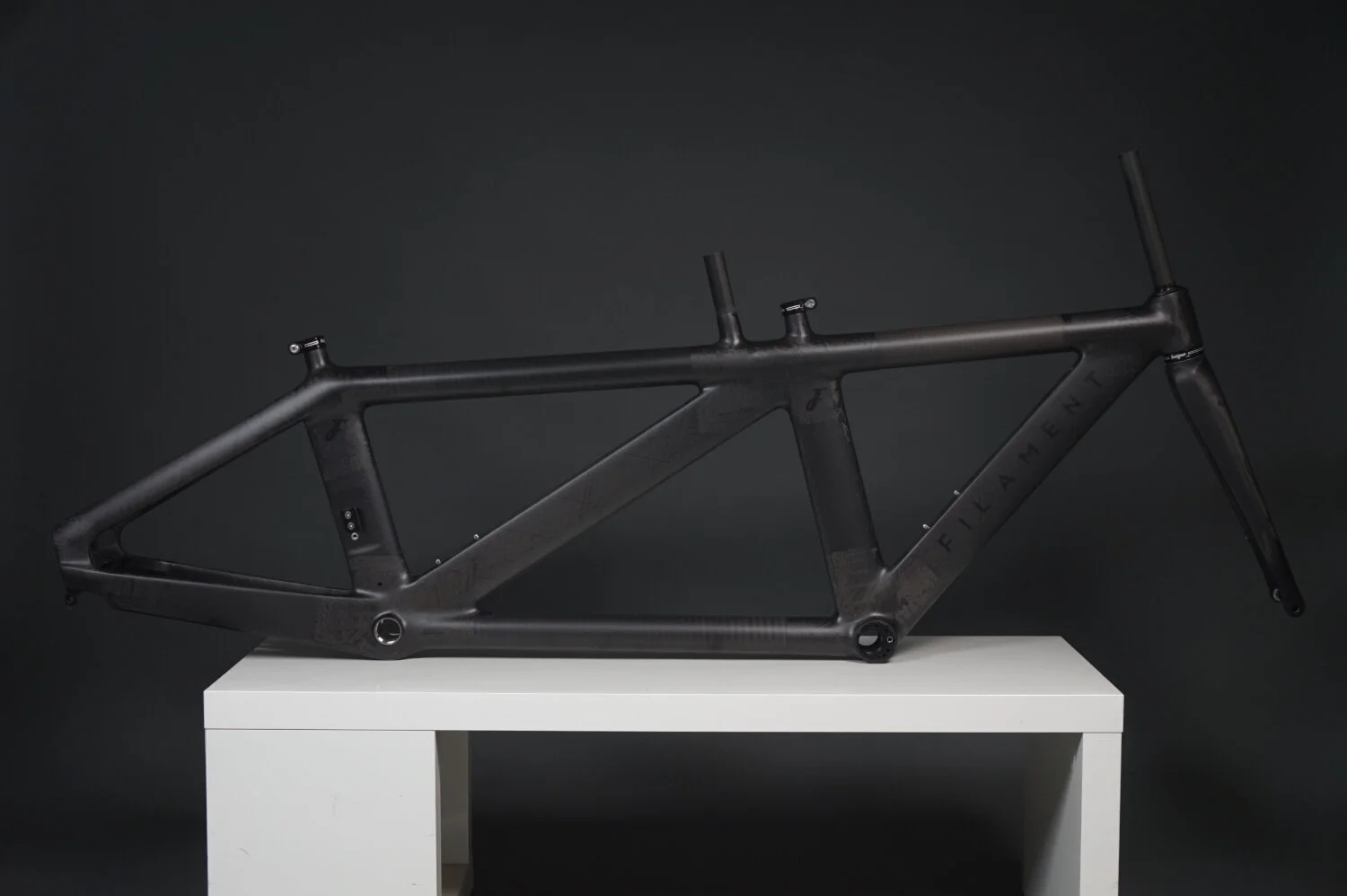 Custom geometry and clearcoat paint finish on a Filament triathlon bicycle frame.